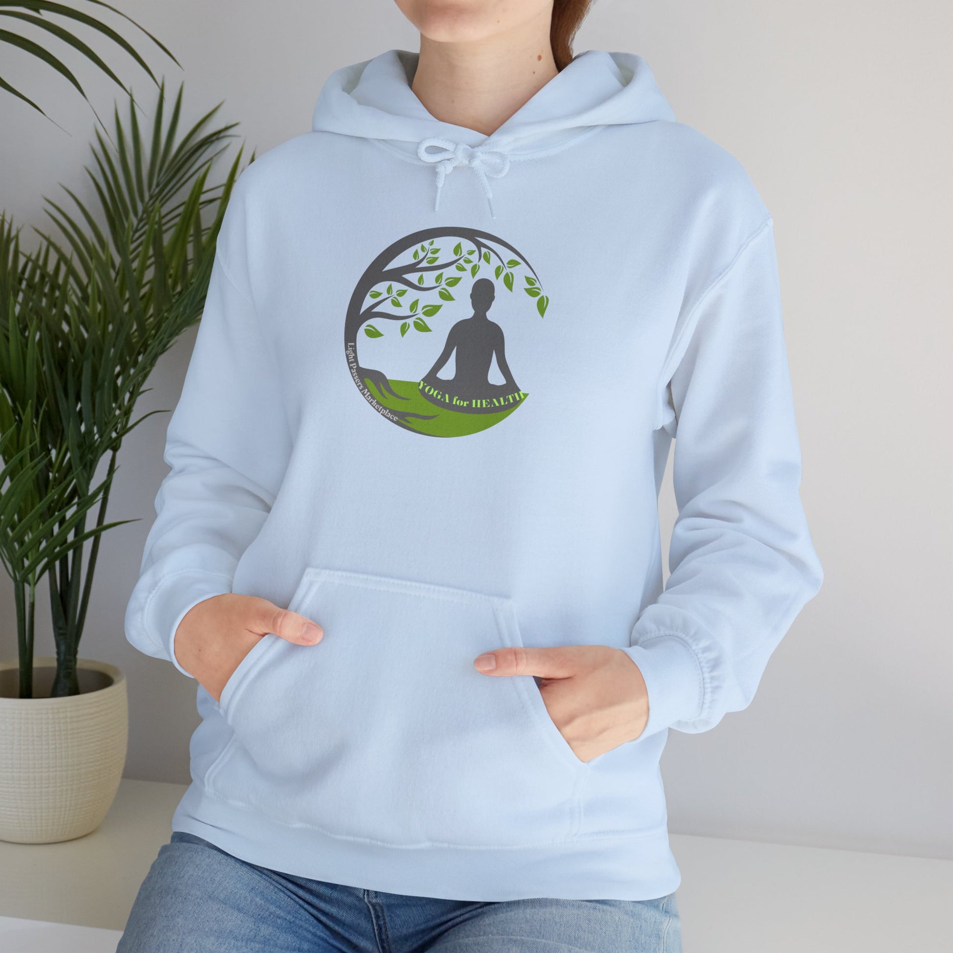 A person in a white logo hoodie with a kangaroo pocket, drawstring hood, and cozy blend of cotton and polyester. Ethically made for comfort and style.