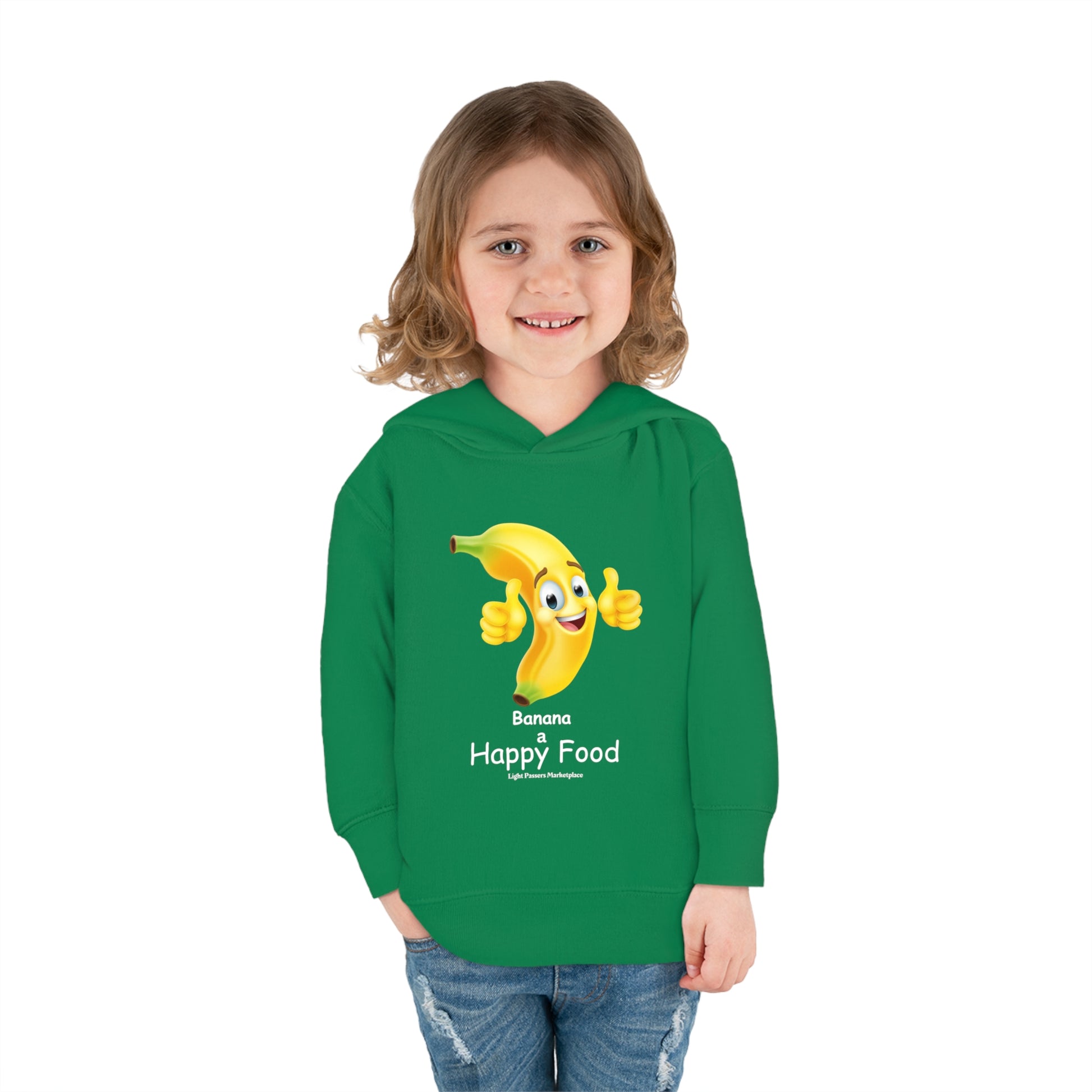 A child in a green cartoon character hoodie smiles, with a cartoon banana giving a thumbs up. Rabbit Skins toddler hoodie with jersey-lined hood, cover-stitched details, and side seam pockets for cozy wear.