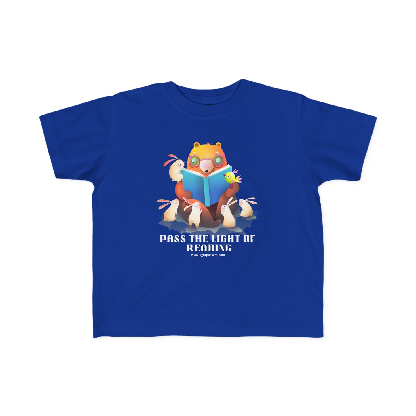 A Pass the Light of Reading Toddler T-shirt featuring a cartoon bear reading to bunnies. Soft 100% combed cotton, durable print, tear-away label, classic fit. Ideal for sensitive skin, first adventures.