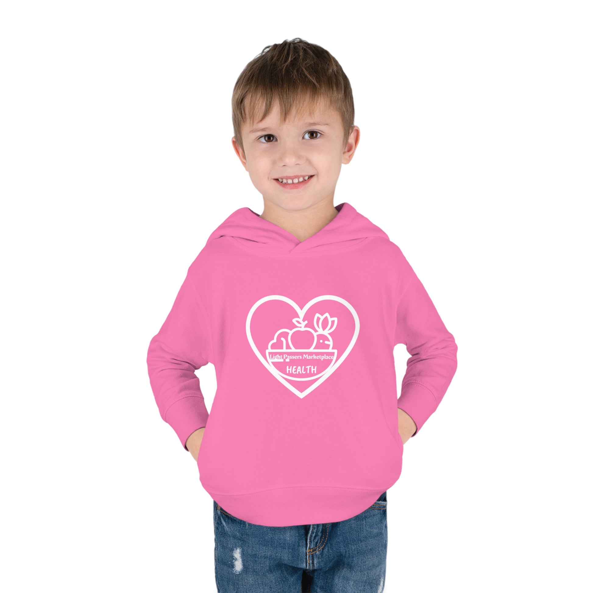 A toddler wearing a pink Fruit Basket Toddler Hoodie with side seam pockets, double-needle hem hood, and cover-stitched details for durability and comfort.