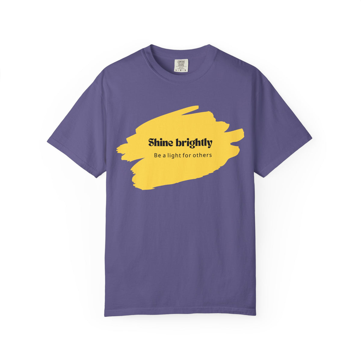 Mystic Blue unisex T-shirt with yellow paint-splash graphic and “Shine brightly” text