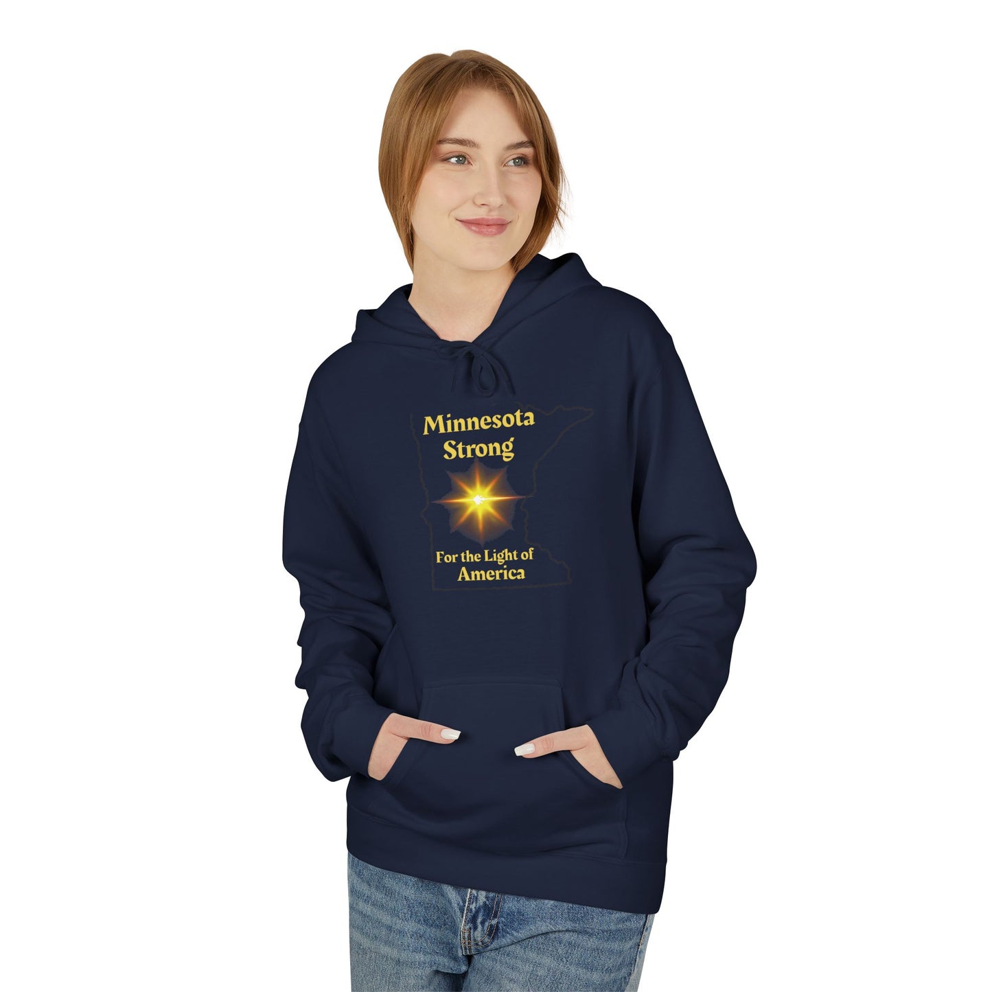 Young woman wearing Love and Peace The Light Adult Unisex Minnesota State Hoodie, featuring Minnesota Strong and starburst design, hands in pocket, smiling.