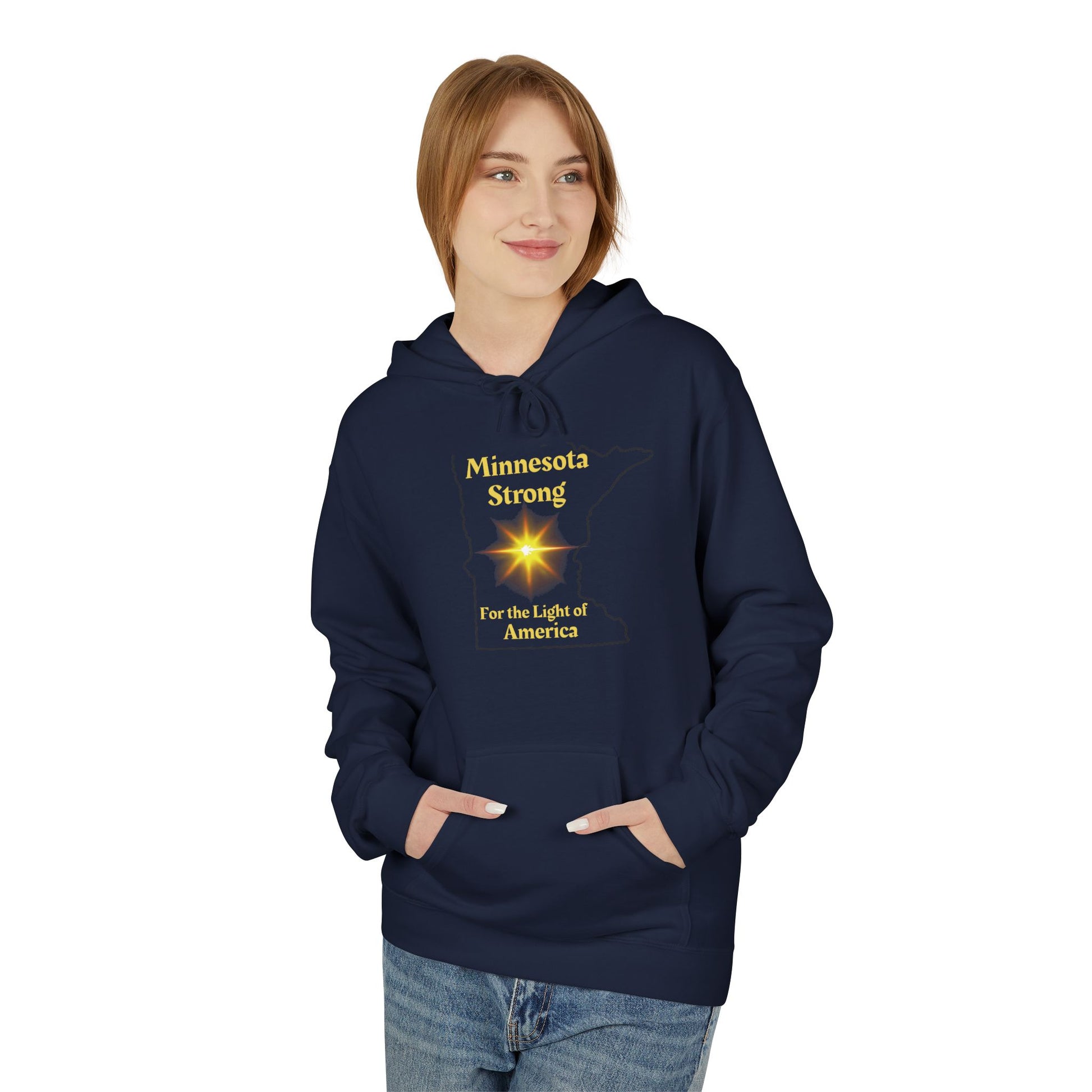 Young woman wearing Love and Peace The Light Adult Unisex Minnesota State Hoodie, featuring Minnesota Strong and starburst design, hands in pocket, smiling.