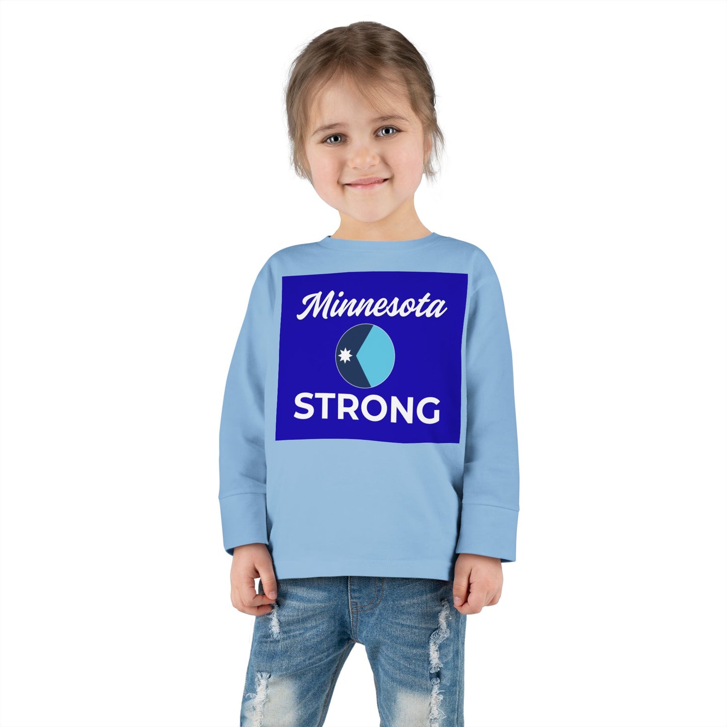 Child wearing a light blue long-sleeve tee with Minnesota STRONG graphic, embodying community pride. Perfect for active toddlers and chilly days.
