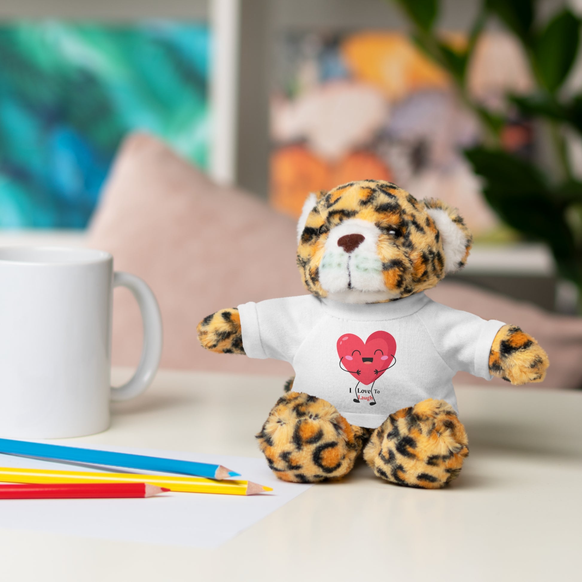 Stuffed animal with a customizable I Love to Laugh shirt, available as Bear, Sheep, Bunny, Jaguar, Panda, or Lion, from Light Passers Marketplace.
