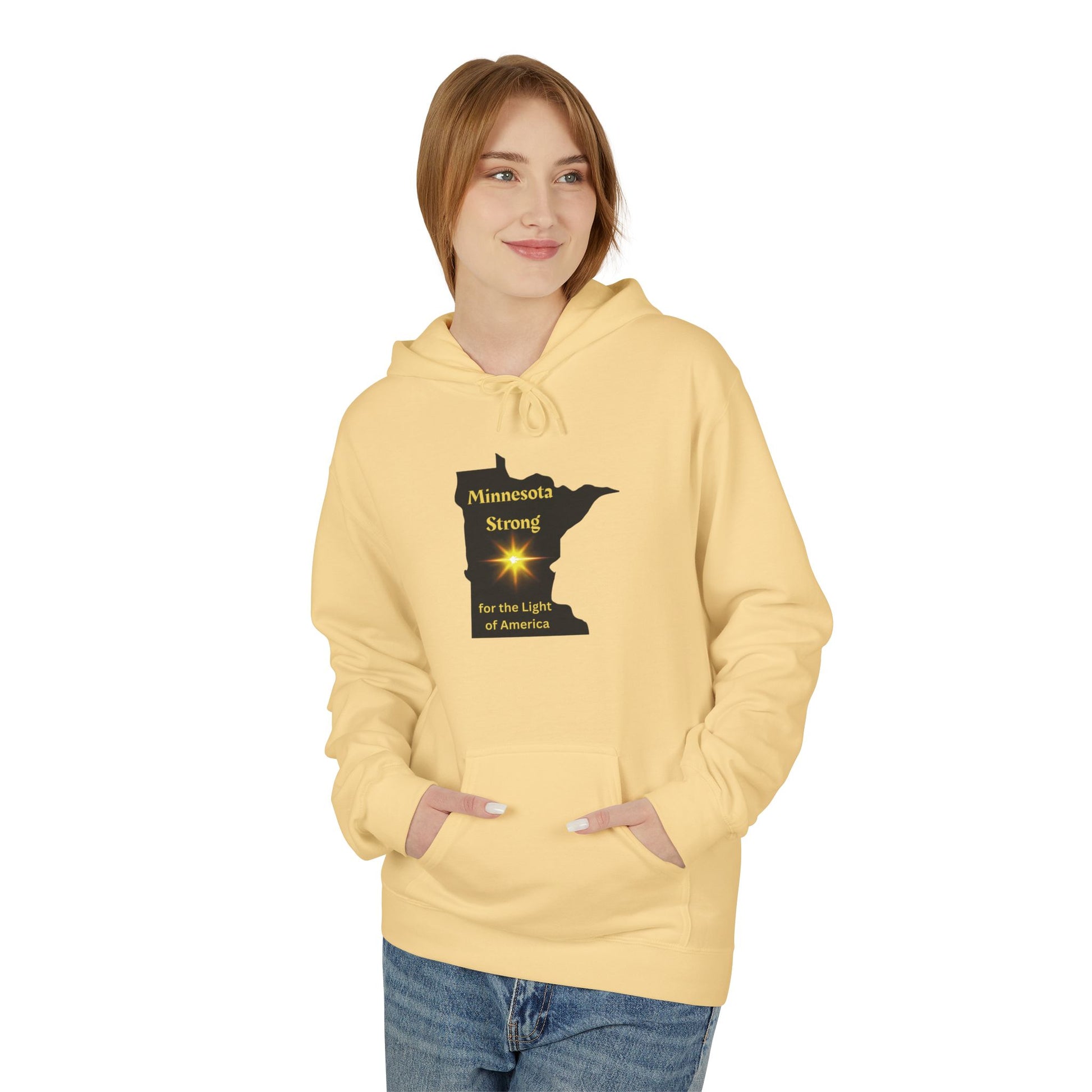 Person wearing the Love and Peace The Light Adult Unisex Minnesota State Hoodie with Minnesota silhouette and star, showcasing Minnesota Strong message. Hands in kangaroo pocket.