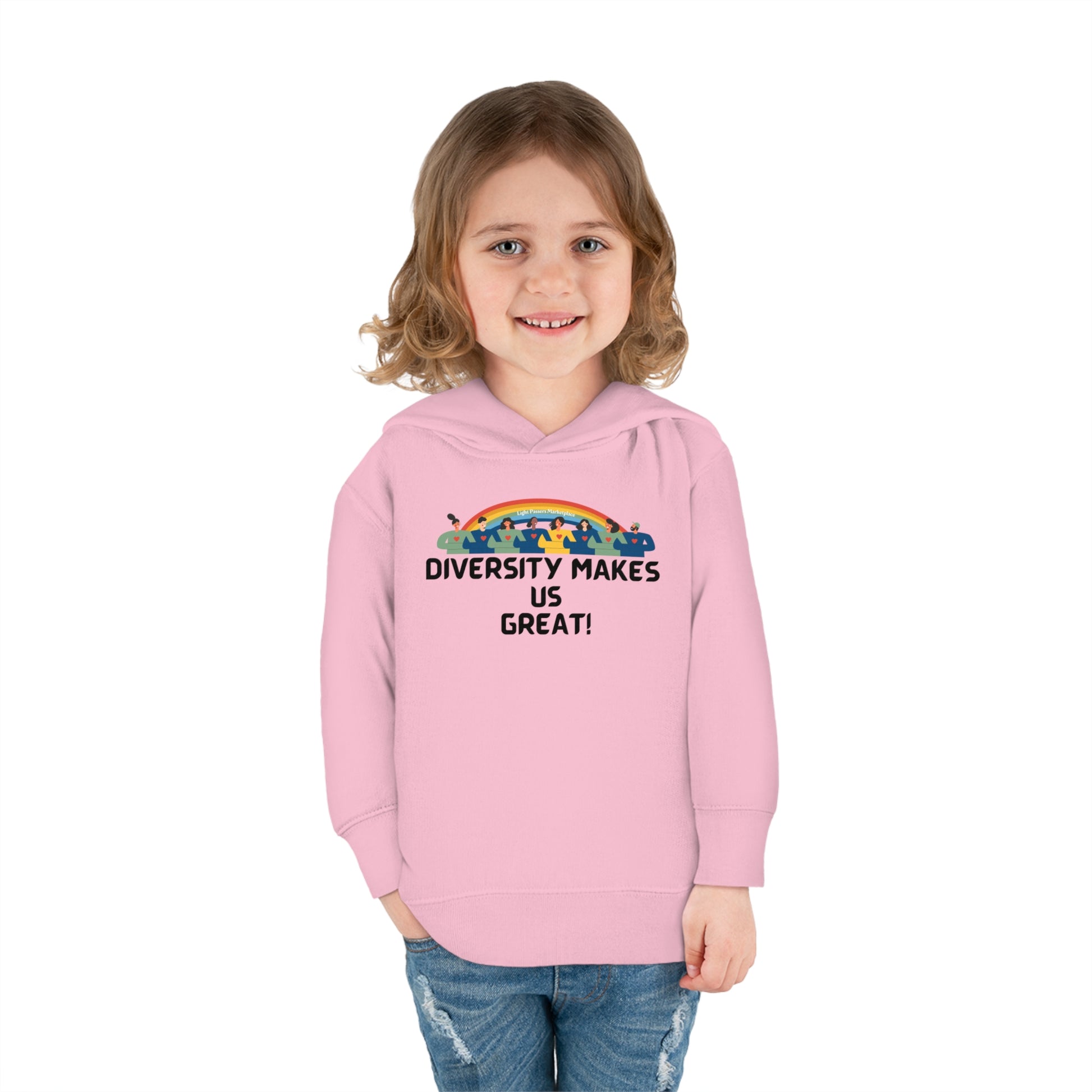 A smiling girl in a pink Rabbit Skins toddler hoodie with side seam pockets and cover-stitched details for durability and comfort.