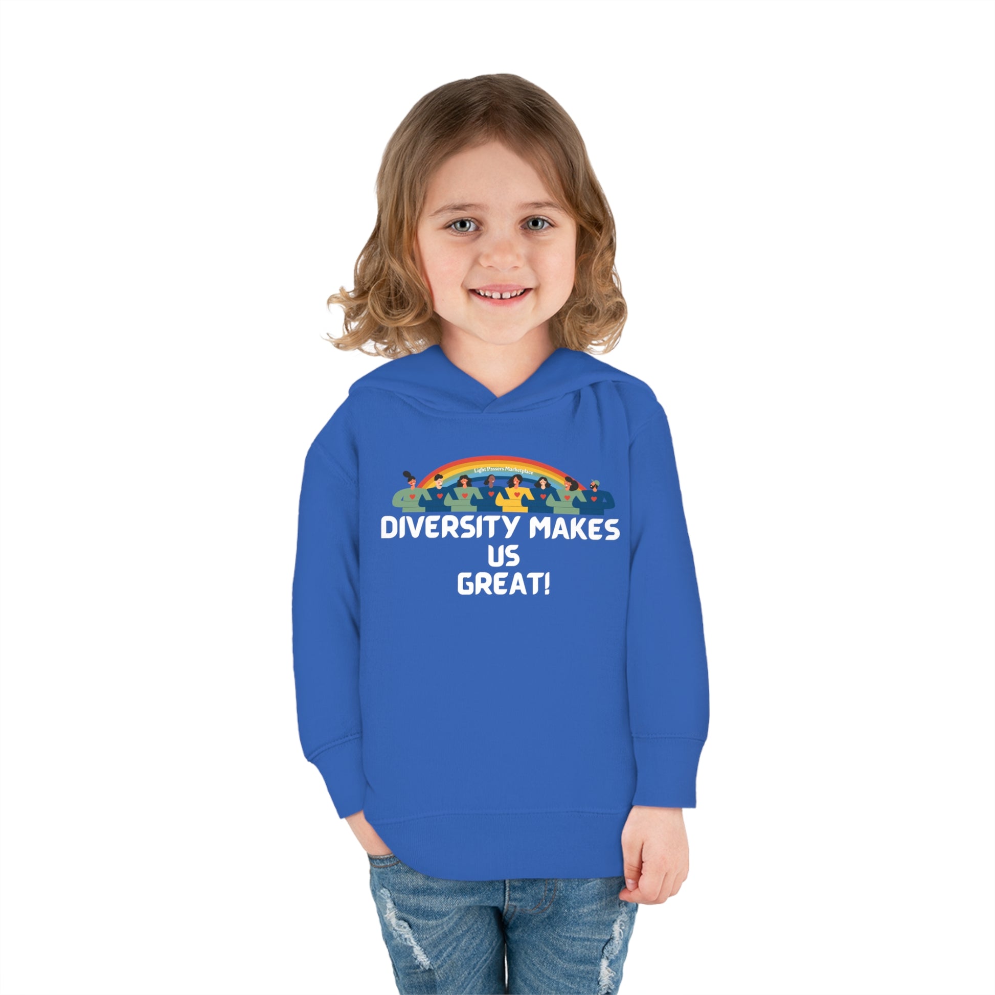 A child in a blue Rainbow People hoodie, smiling. Features jersey-lined hood, cover-stitched details, side pockets, and durable fabric blend for cozy wear. Product title: Diversity Makes Us Great Toddler Hooded Sweatshirt.