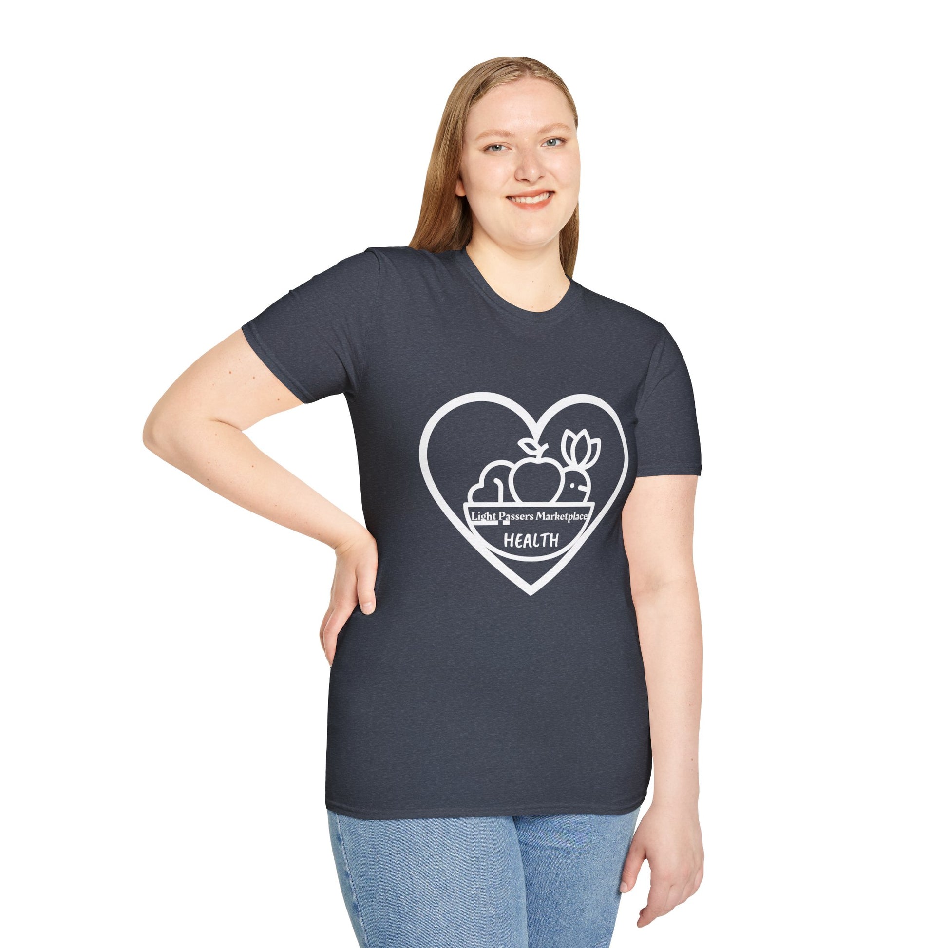 A woman in a soft-style unisex t-shirt with a heart logo, paired with blue jeans. Made of 100% ring-spun cotton, featuring twill tape shoulders for durability and ribbed collar.