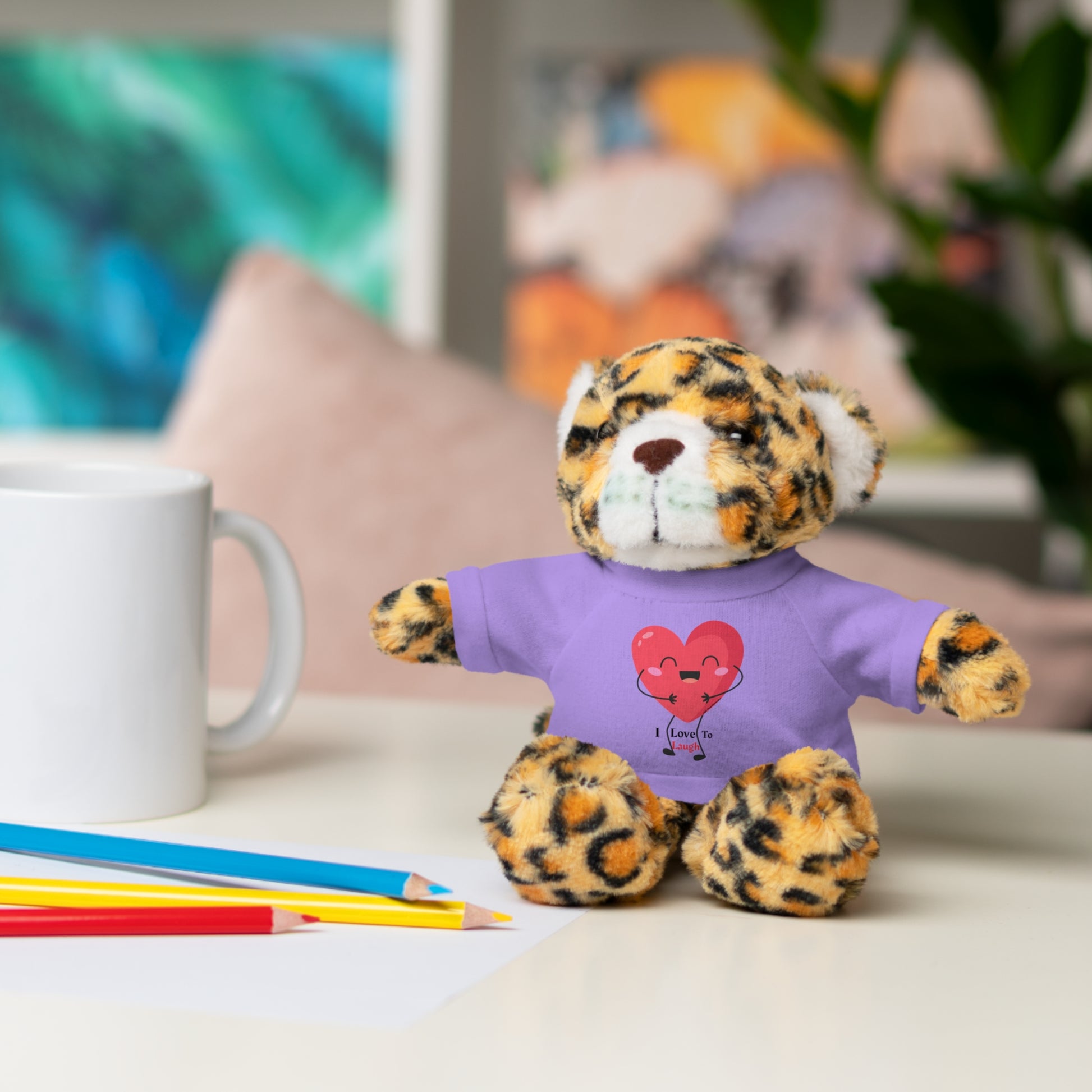 Stuffed animal wearing a removable I Love to Laugh heart T-shirt, available in six options: Bear, Sheep, Bunny, Jaguar, Panda, Lion. Perfect for gifting.