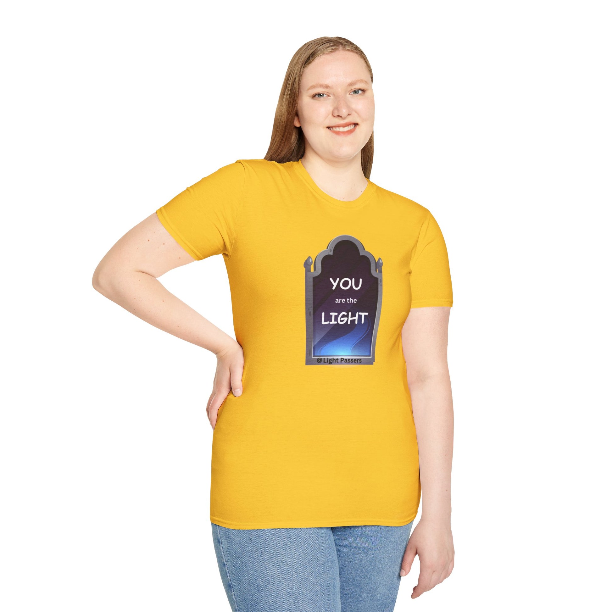 A woman in a yellow shirt smiles, posing in the Light Mirror Unisex T-shirt. Close-up of blue jeans. Casual, classic fit tee with premium printing quality.