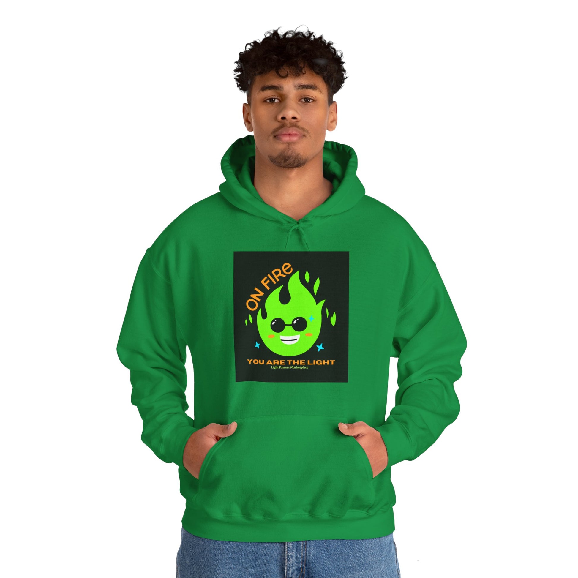 A man in a green hooded sweatshirt with a flame and cartoon character design, showcasing a cozy, cotton-polyester blend for warmth and comfort.