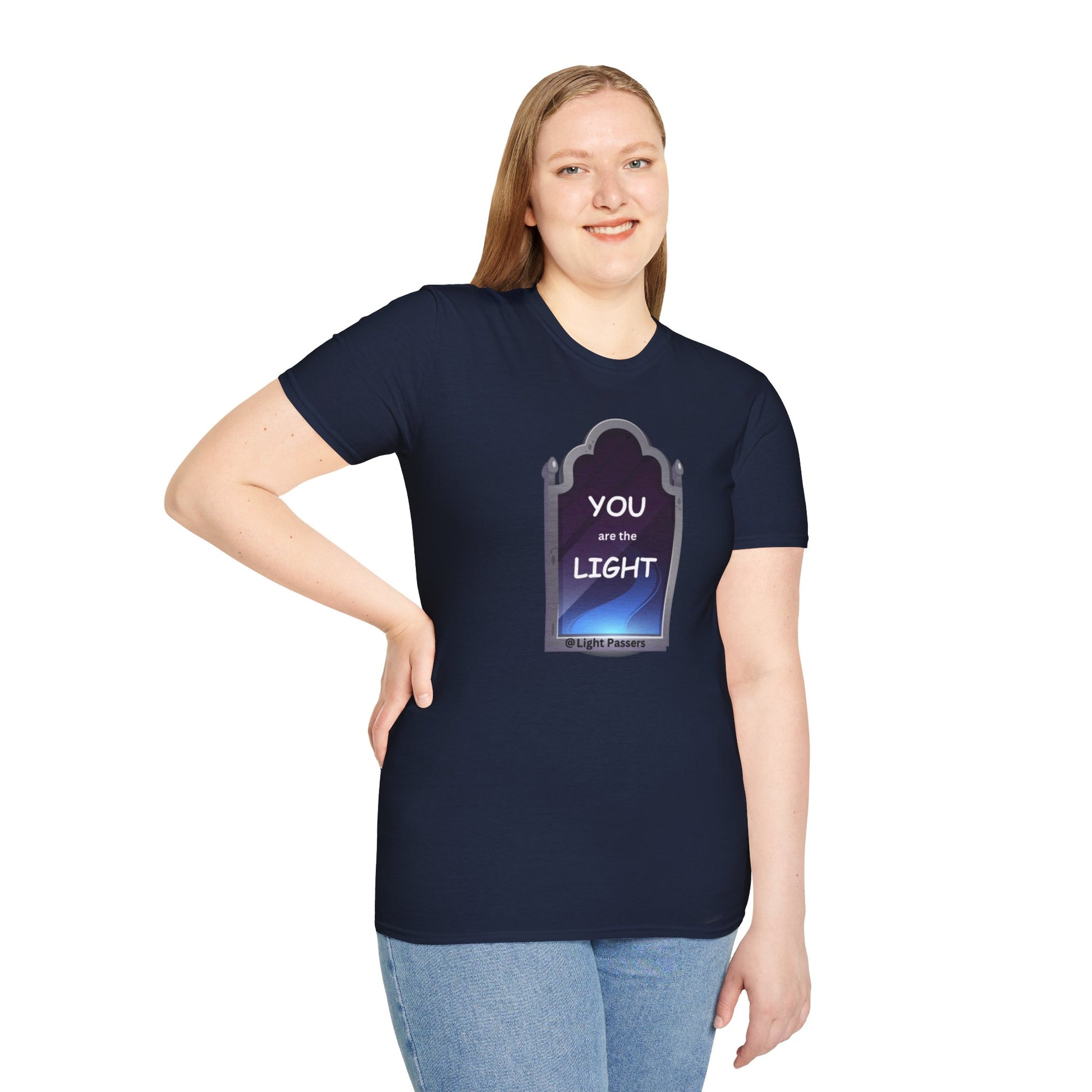 A woman in a blue shirt smiles, posing in the Light Mirror Unisex T-shirt. Close-up of jeans. Casual, 100% cotton tee with smooth surface for vivid printing.