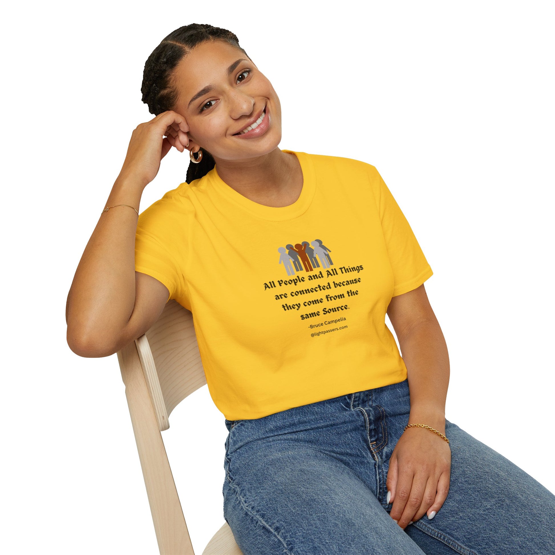 A woman in a yellow shirt smiles, sitting on a chair, showcasing the All People are Connected red and gray design Unisex T-shirt. The tee features a classic fit, smooth fabric, and durable construction for everyday wear.