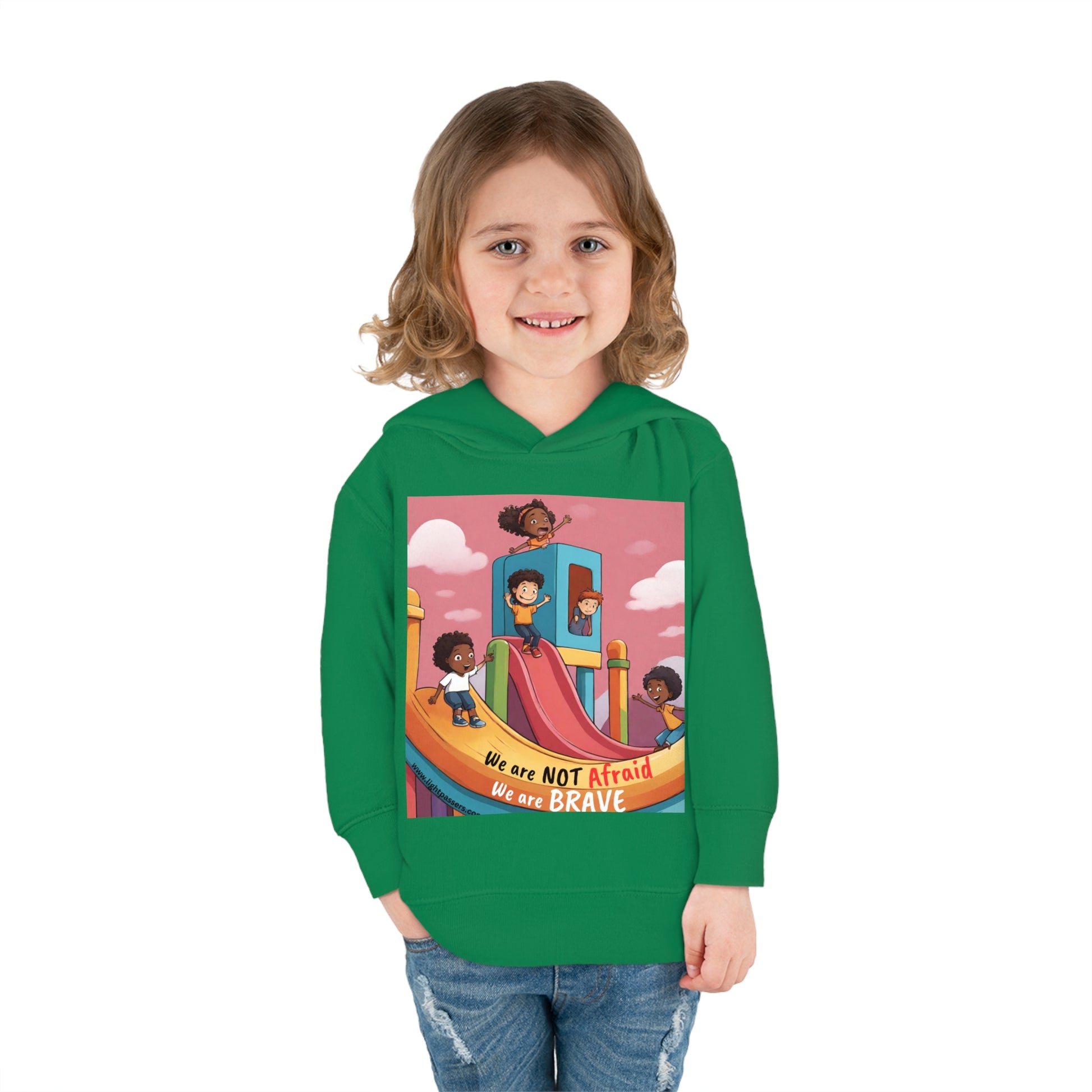 A toddler in a Rabbit Skins hoodie smiles, showcasing comfort and durability. Features jersey-lined hood, cover-stitched details, and side-seam pockets for coziness.