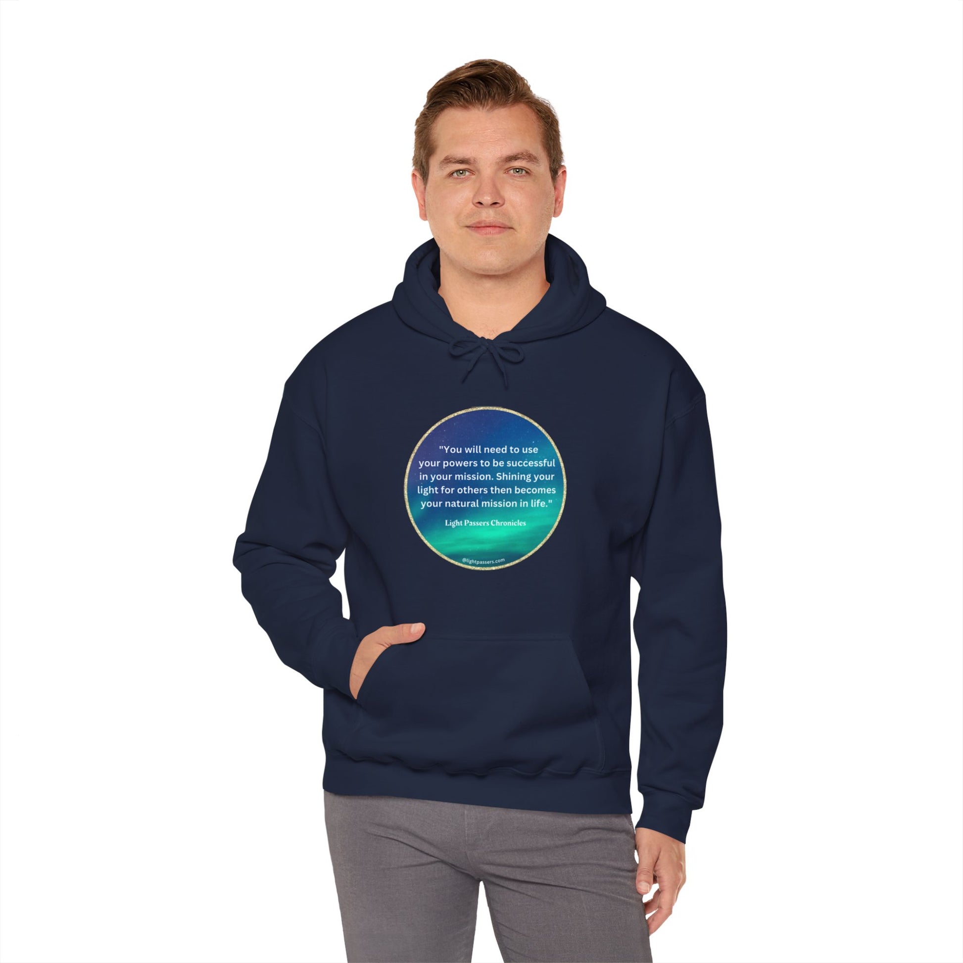 A person in a blue hoodie with a circular turquoise design and text, featuring a kangaroo pocket and color-matched drawstring. Made of 50% cotton and 50% polyester for warmth and comfort.