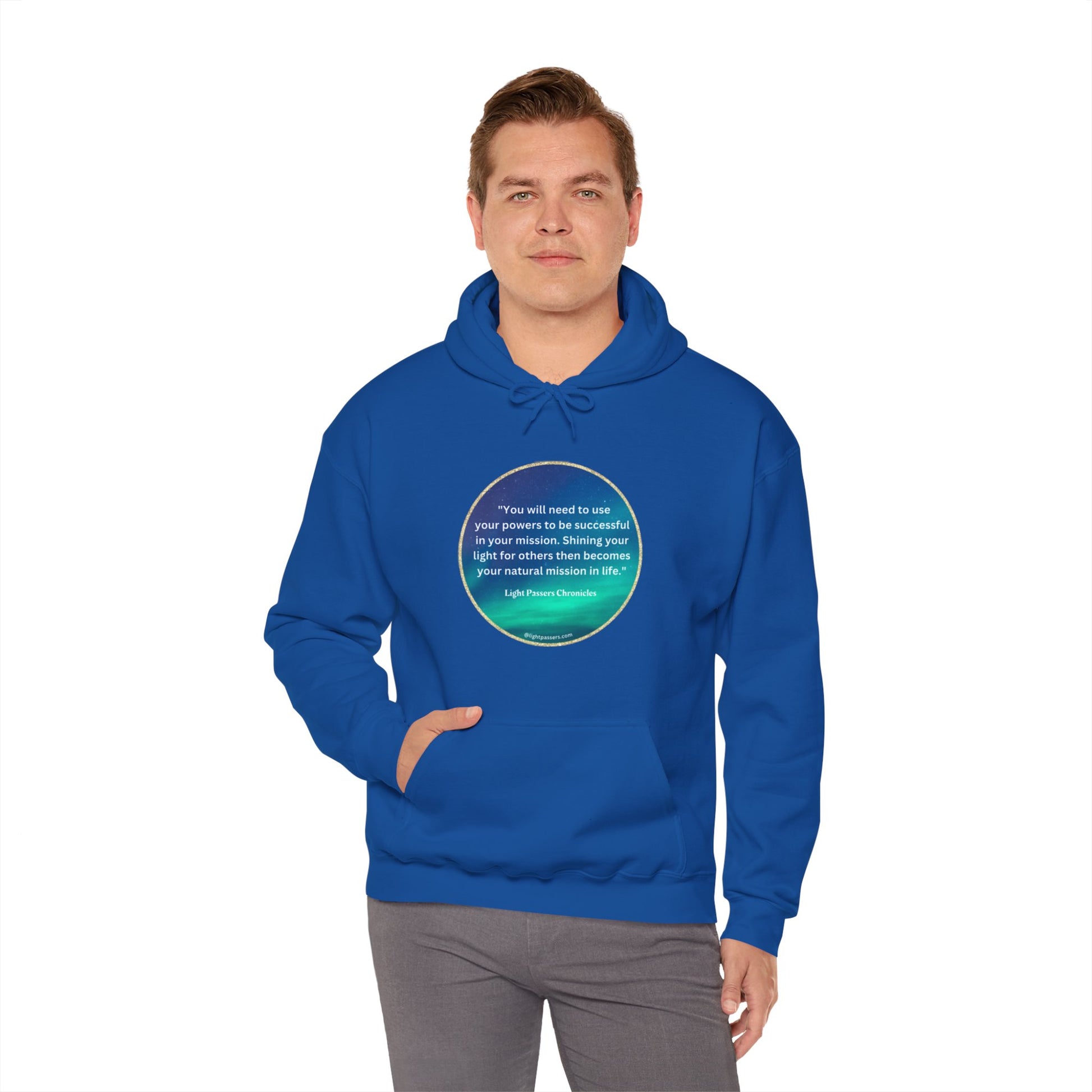 A person in a blue hooded sweatshirt with a quote on it, featuring a kangaroo pocket and color-matched drawstring. Made of 50% cotton and 50% polyester for warmth and comfort.