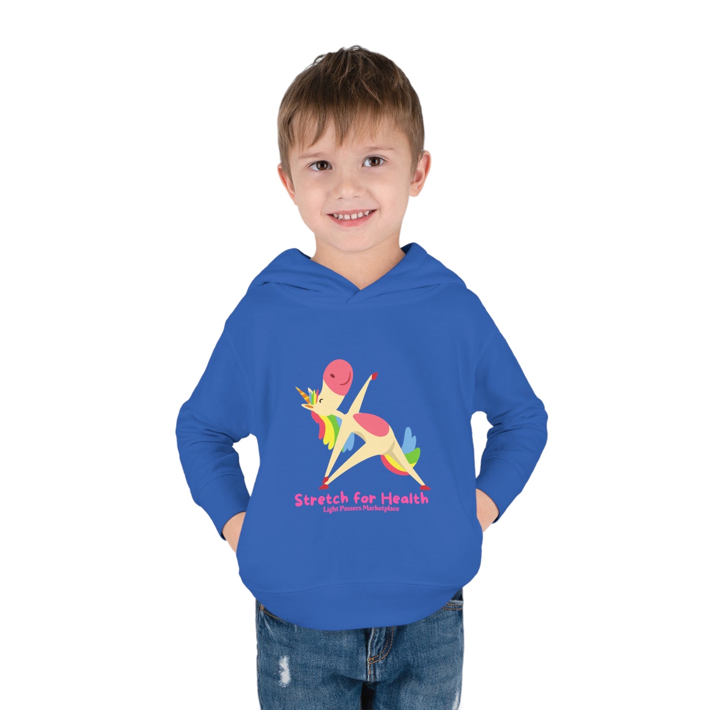 A smiling boy in a Rabbit Skins Unicorn Stretch Toddler Hooded Sweatshirt with side seam pockets, jersey-lined hood, and durable stitching for lasting coziness.
