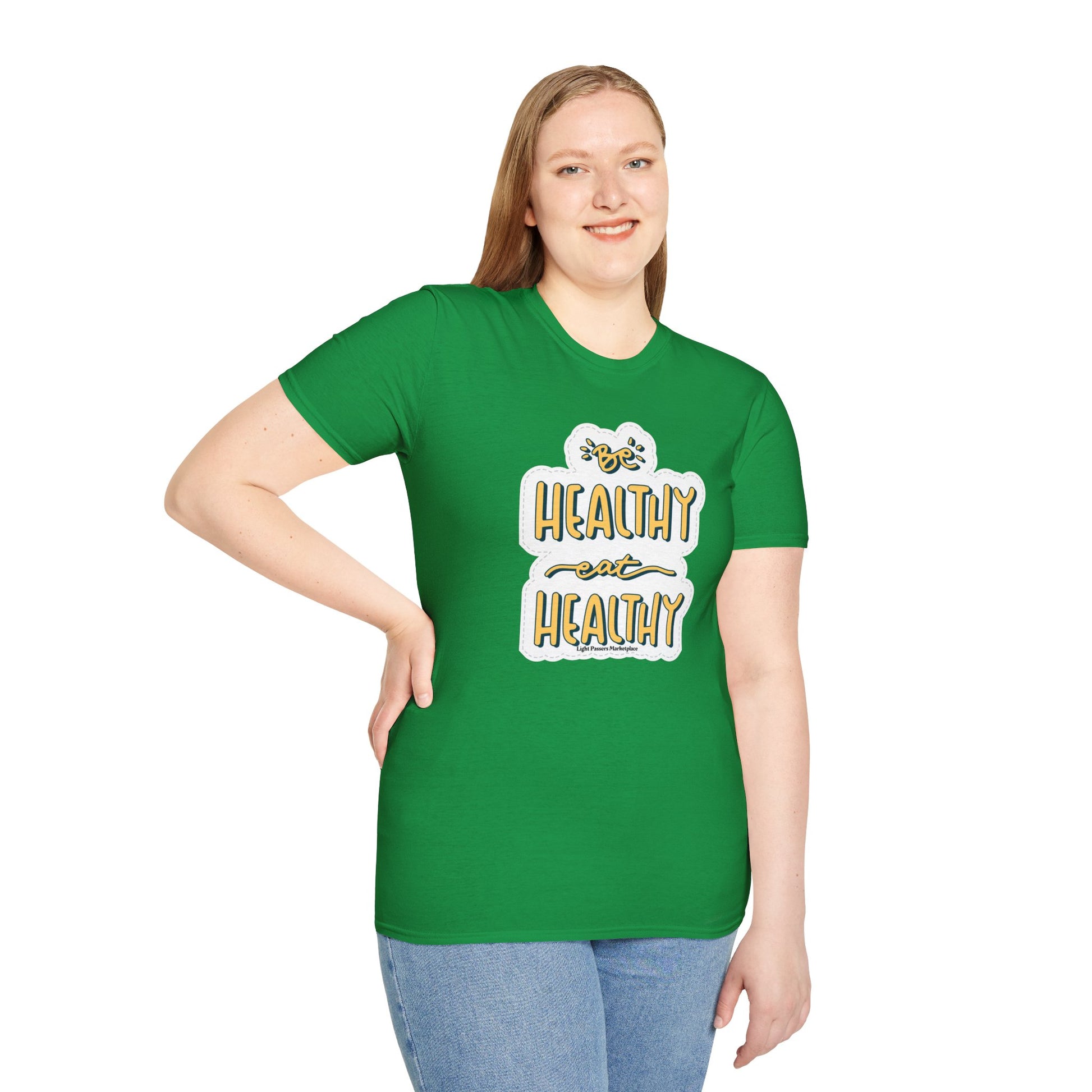 A woman in a green shirt, close-up of blue jeans. Unisex soft-style t-shirt, 100% cotton, twill tape shoulders, no side seams, ribbed collar, lightweight fabric, classic fit, tear-away label, ethically sourced US cotton.