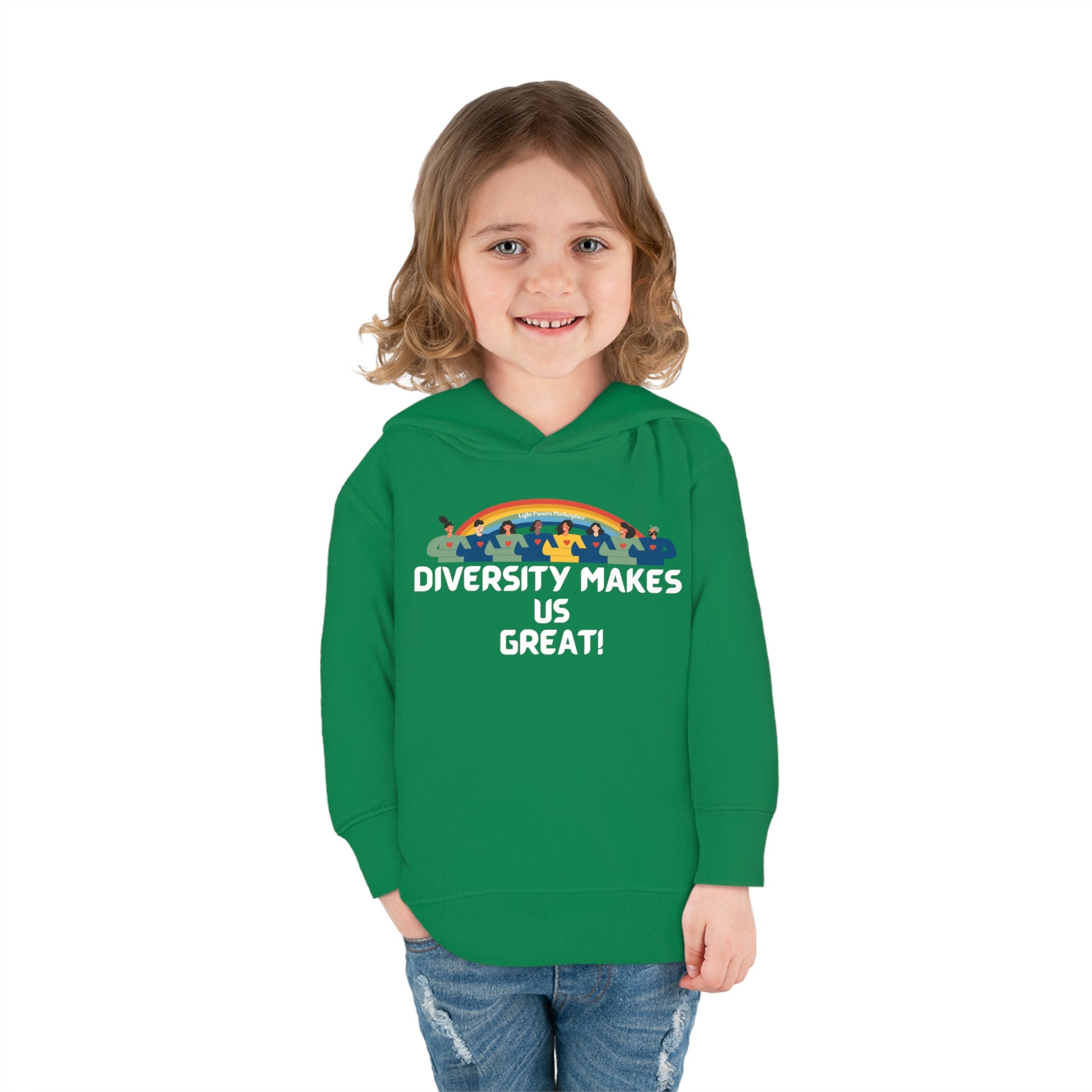 A smiling child in a green Rainbow-themed toddler hoodie with side seam pockets and double-needle hem hood. Designed for comfort and durability with cover-stitched details, perfect for cozy days.