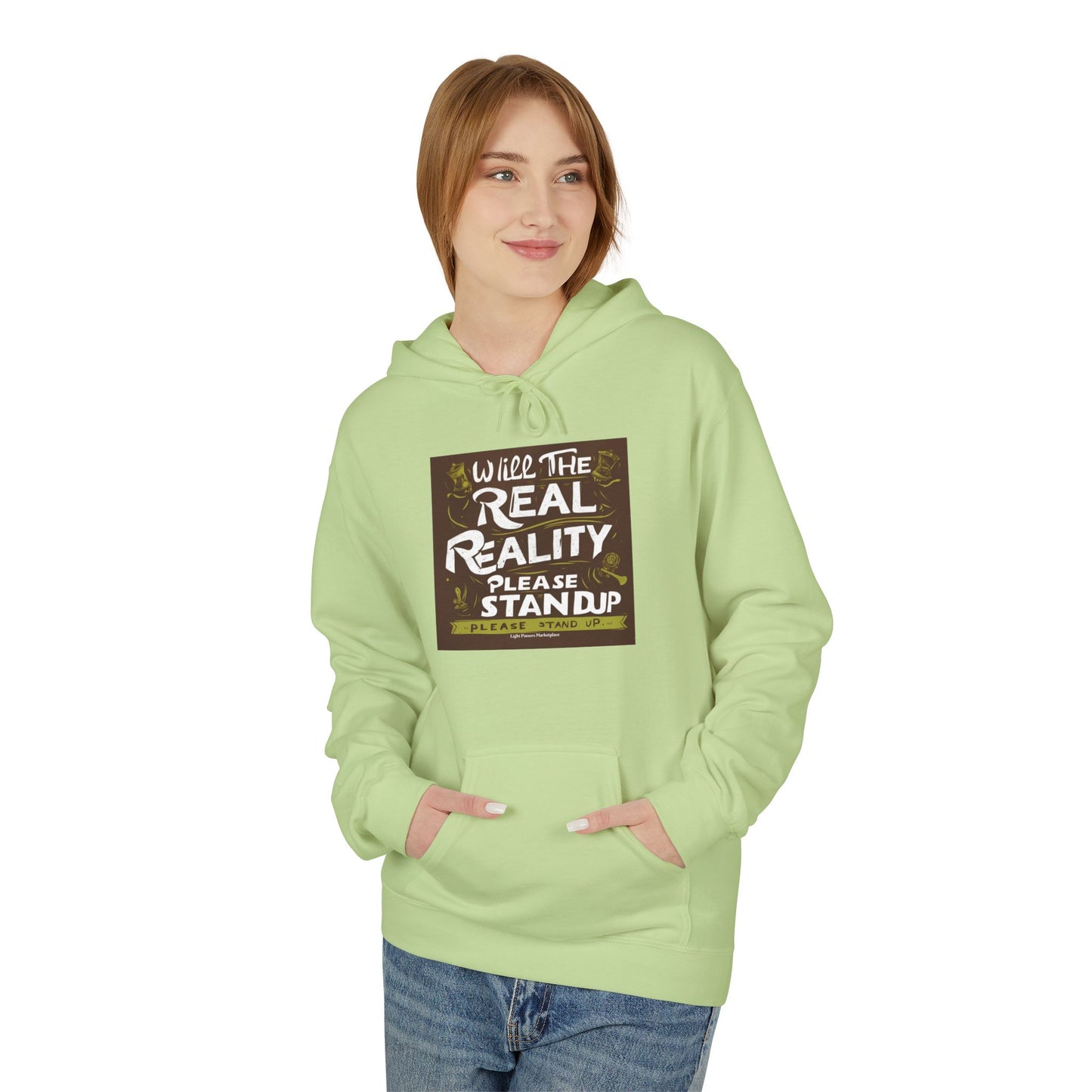 Young woman wears Will the Real Reality Please Stand Up hoodie with kangaroo pocket and relaxed fit, embodying Light Passers Marketplace's thoughtful, wearable messages.