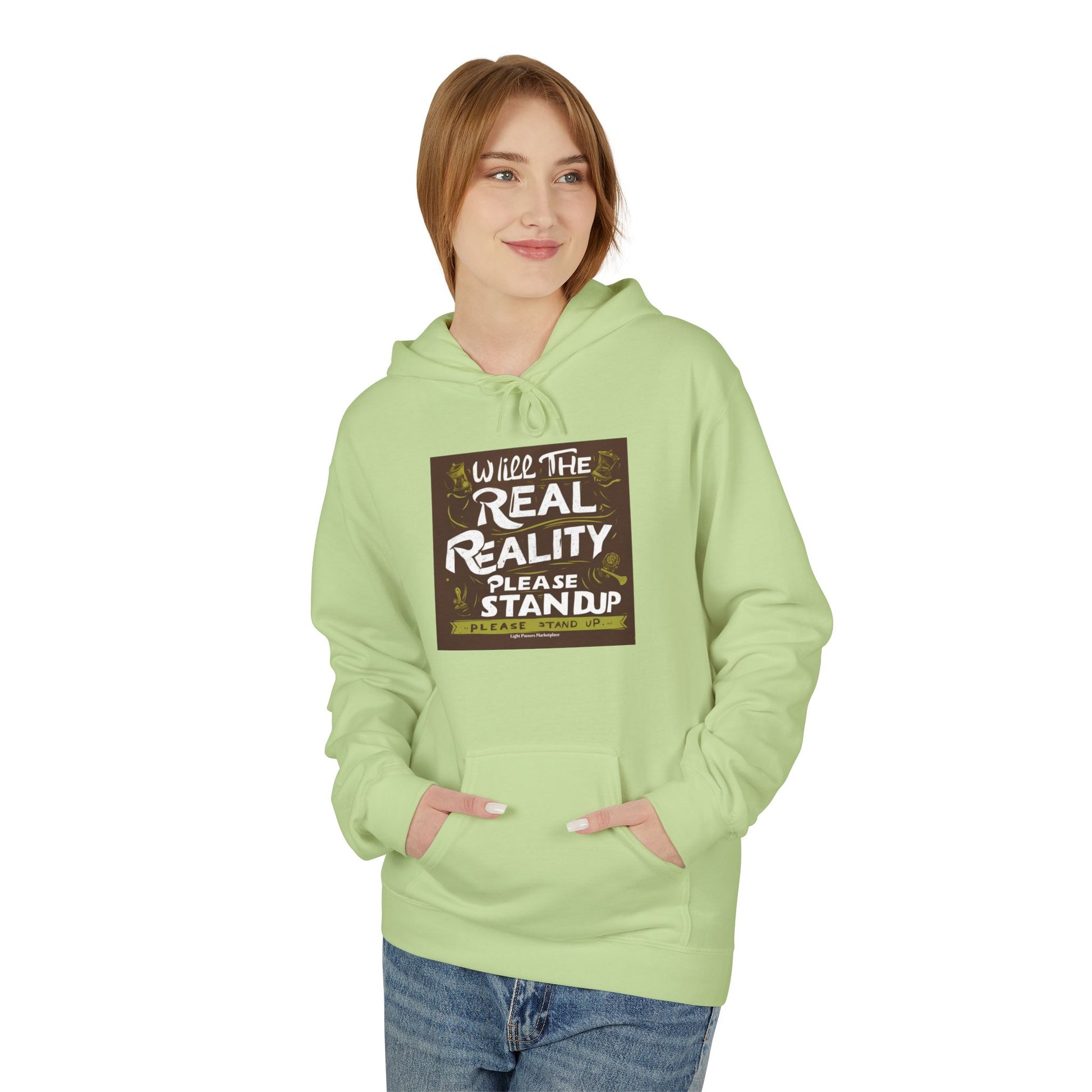 Young woman wears Will the Real Reality Please Stand Up hoodie with kangaroo pocket and relaxed fit, embodying Light Passers Marketplace's thoughtful, wearable messages.