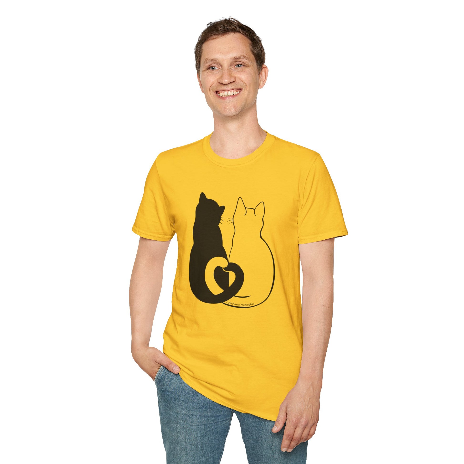 A man in a yellow Cats in Love unisex t-shirt, smiling, showcasing the black cat and heart design. Made of soft 100% cotton, with twill tape shoulders for durability, and a ribbed collar.