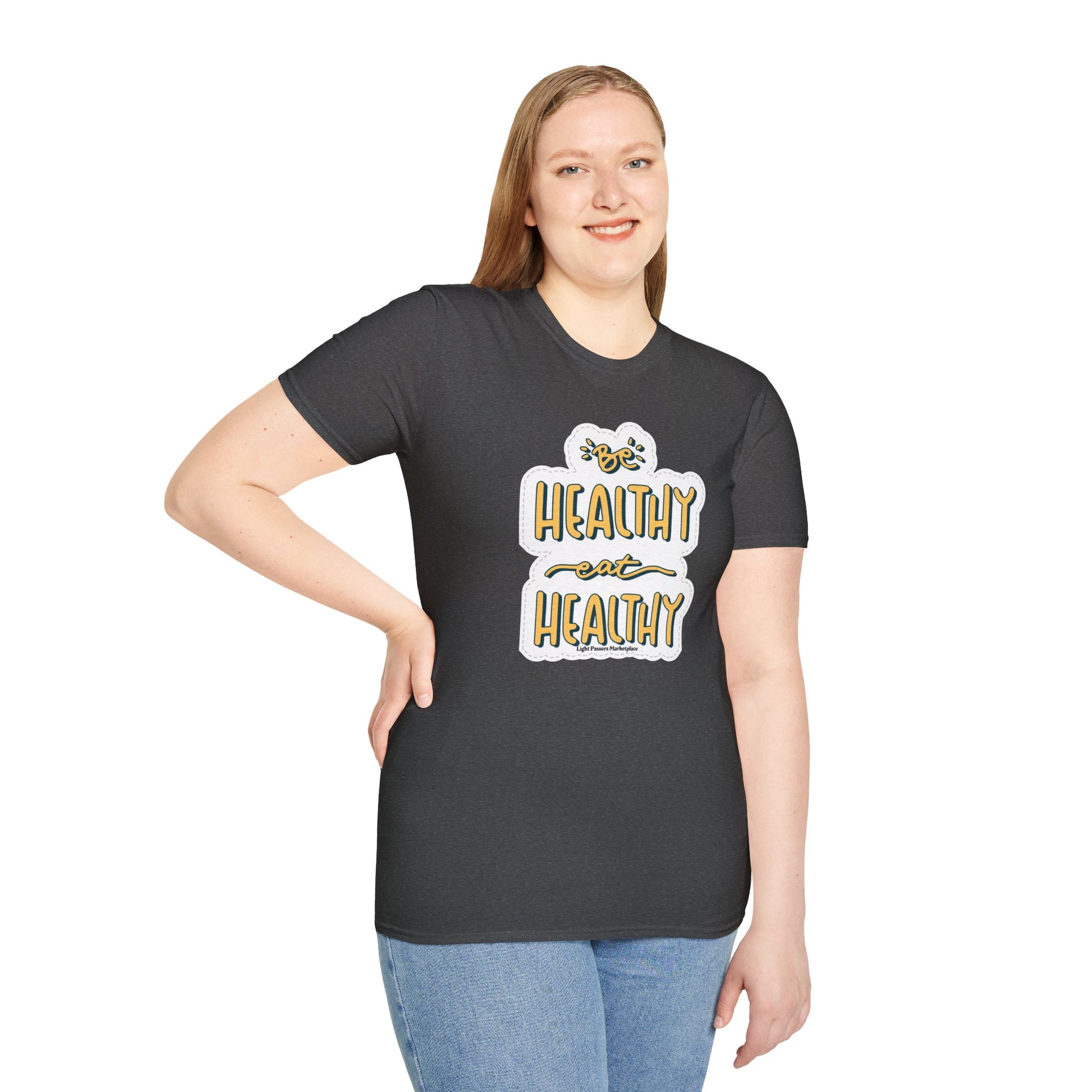 A woman in a grey Be Healthy Eat Healthy Unisex T-Shirt, smiling at the camera. Soft 100% cotton tee with twill tape shoulders, no side seams, and ribbed collar. Casual comfort with ethical US cotton.