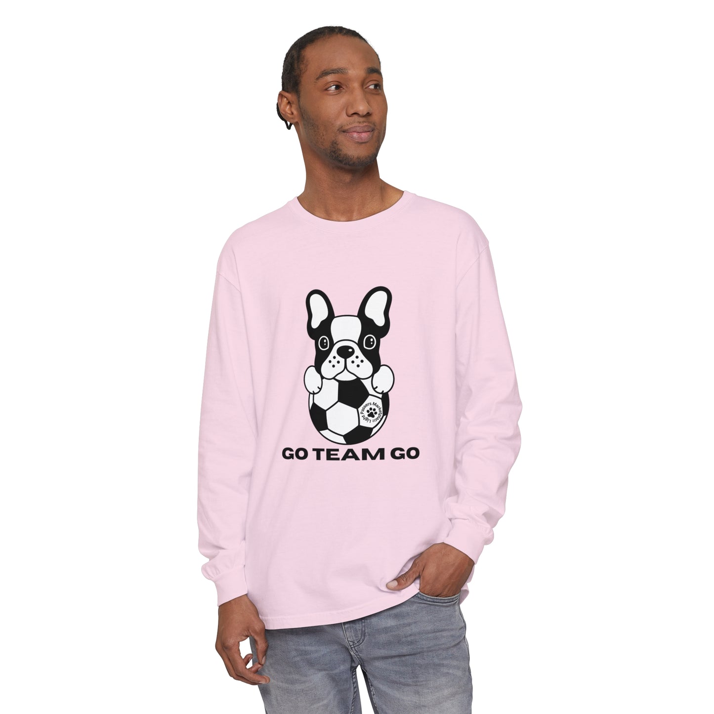 Man wearing Teams Soccer Dog Adult Unisex Garment-dyed Long Sleeve, featuring a dog graphic with a football, showcasing its relaxed fit and soft, cotton fabric.