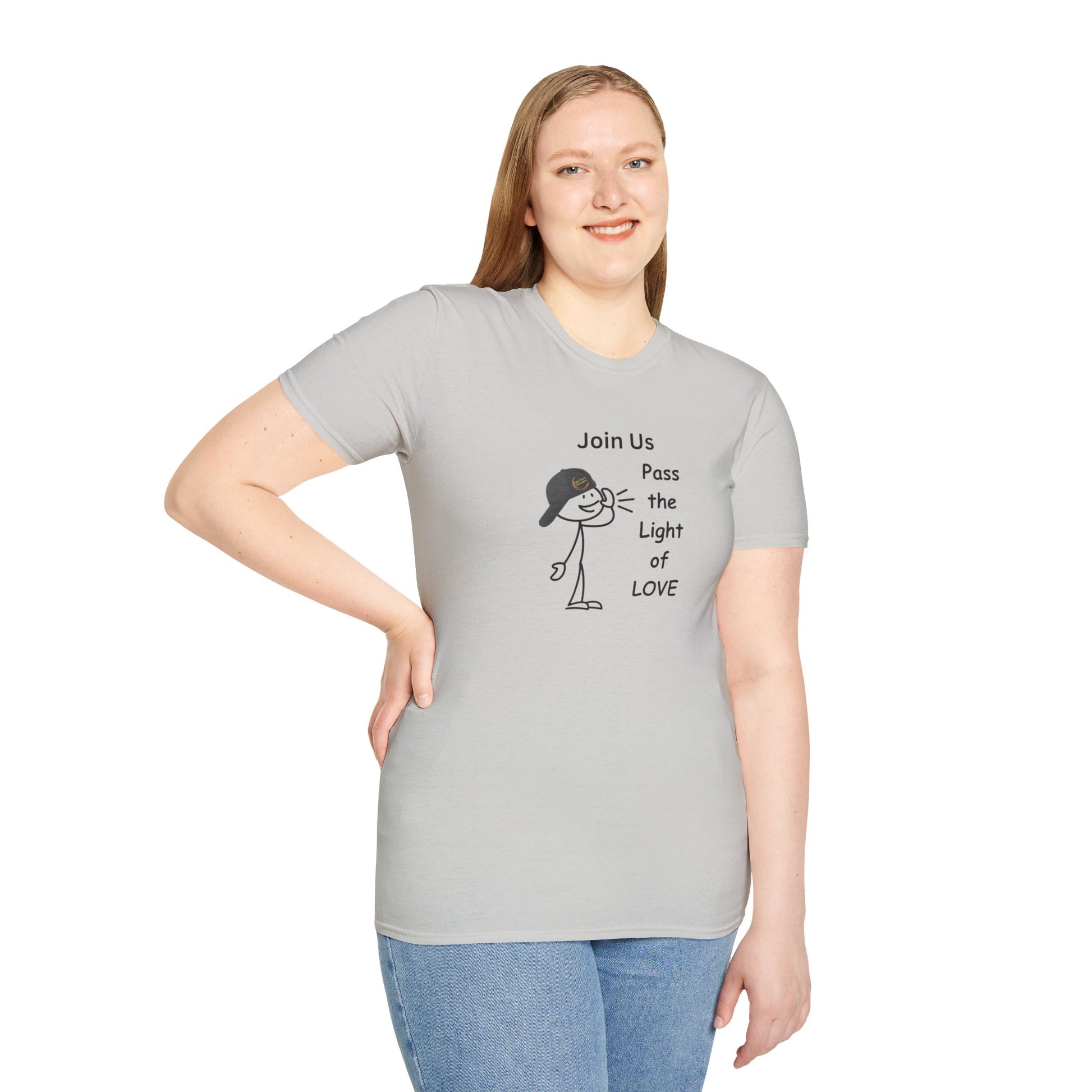 A woman in a casual dress, smiling, wearing a Join Us Pass the Light of Love Unisex T-shirt. The image shows a person posing for a picture, emphasizing the shirt's classic fit and 100% cotton material.