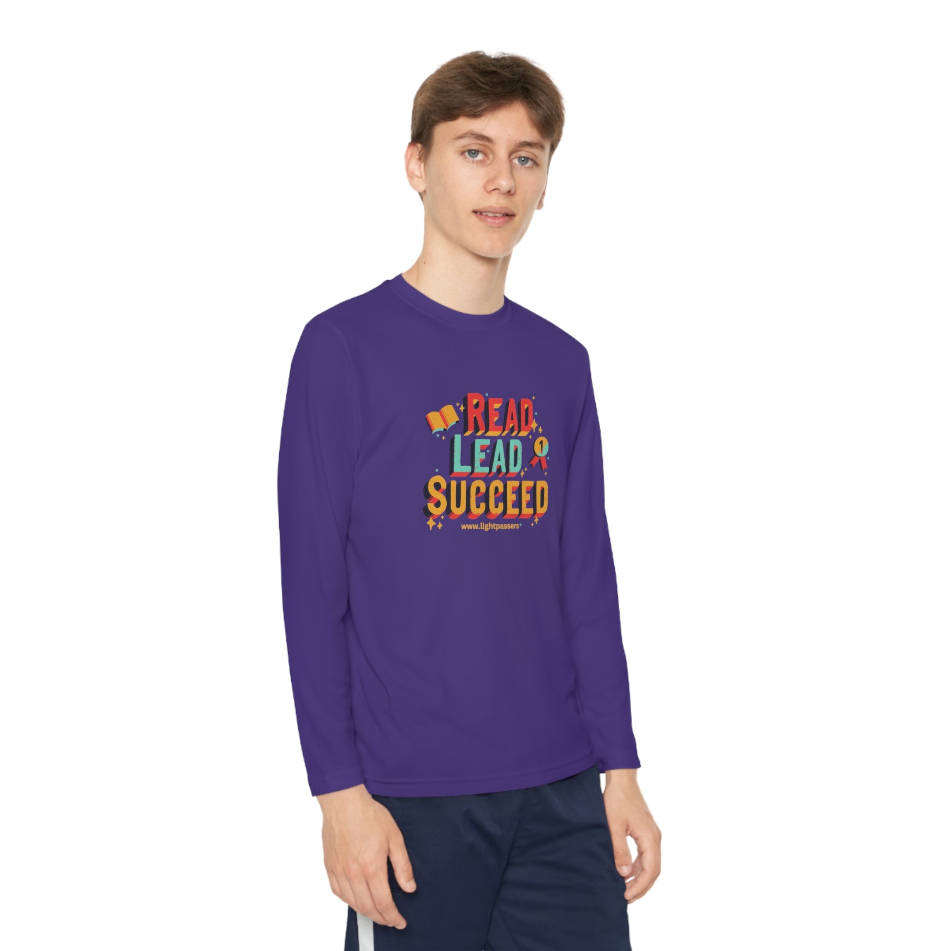 Youth wearing Long Sleeve Read Lead and Succeed T-Shirt, showcasing its athletic fit and comfortable design, ideal for active kids and book enthusiasts.