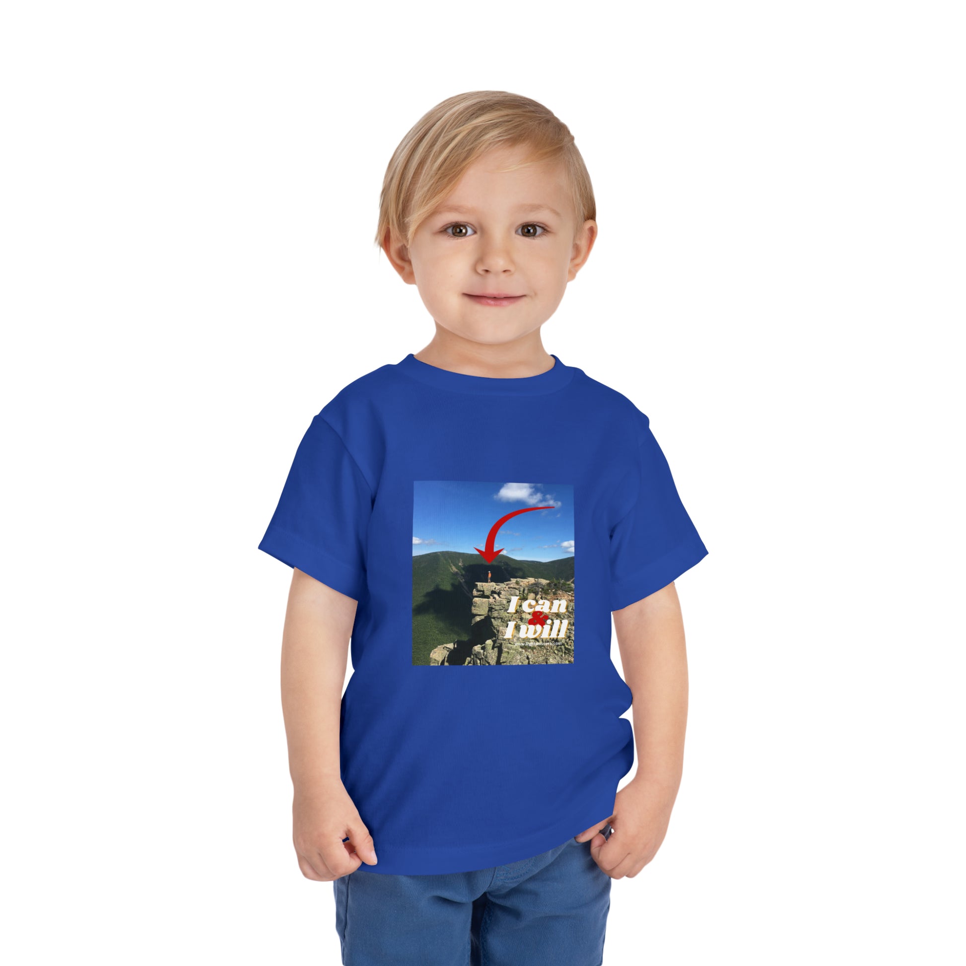 A determined toddler in a blue I Can and I Will Hiking tee, made of 100% Airlume cotton, tear-away label for comfort.