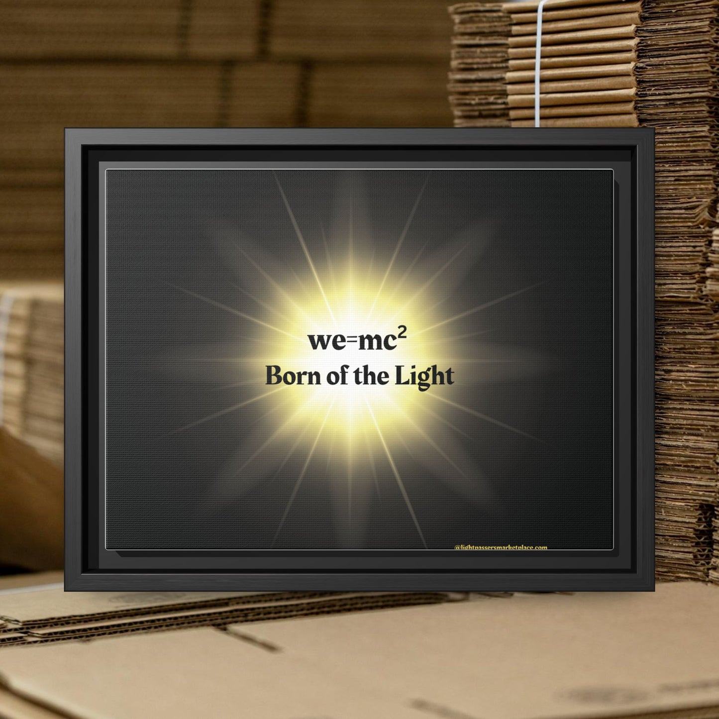 Inspirational Framed Canvas Art - we=mc² Born of the Light, featuring vibrant text on a matte canvas within a sleek black frame, perfect for inspiring creativity.