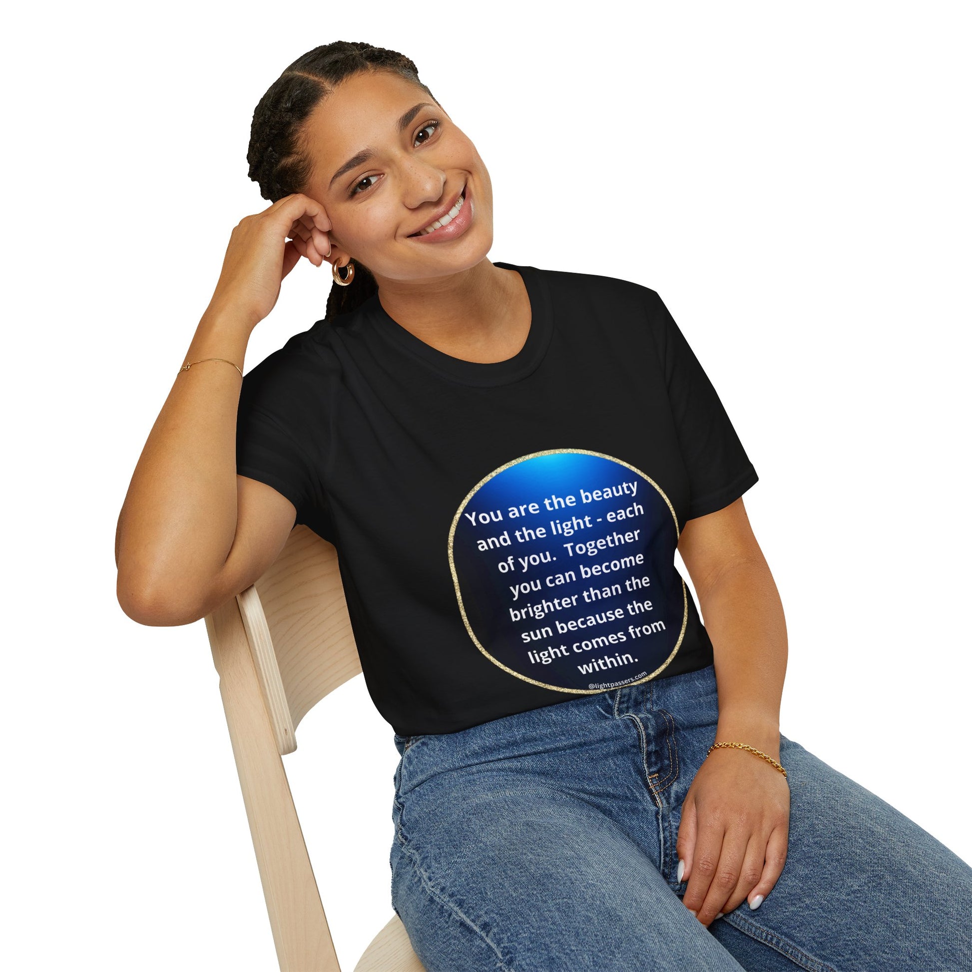 A woman in a black shirt smiles, sitting on a chair, showcasing the Beauty Navy Circle Unisex T-shirt. The tee offers a classic fit, 100% cotton, tear-away label, and smooth surface for vibrant prints.