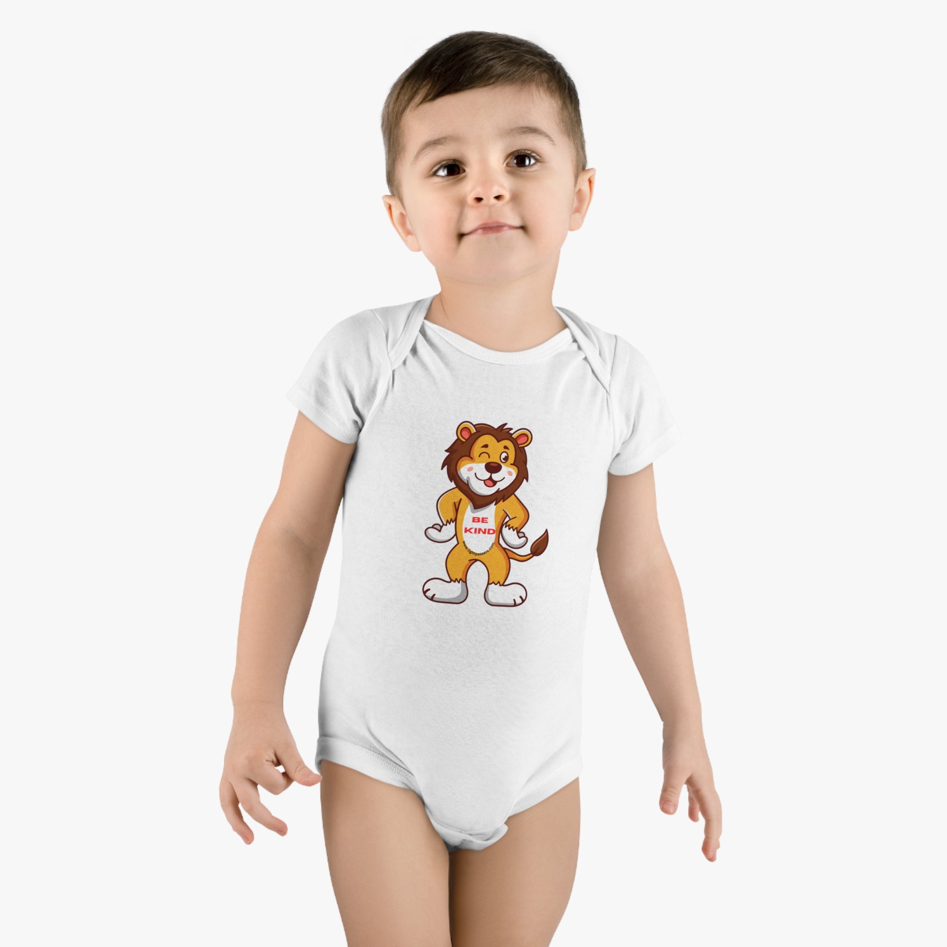 A baby in a white bodysuit featuring a cartoon lion, made of 100% organic cotton with bottom snap closure. OEKO-TEX® certified for softness and durability.