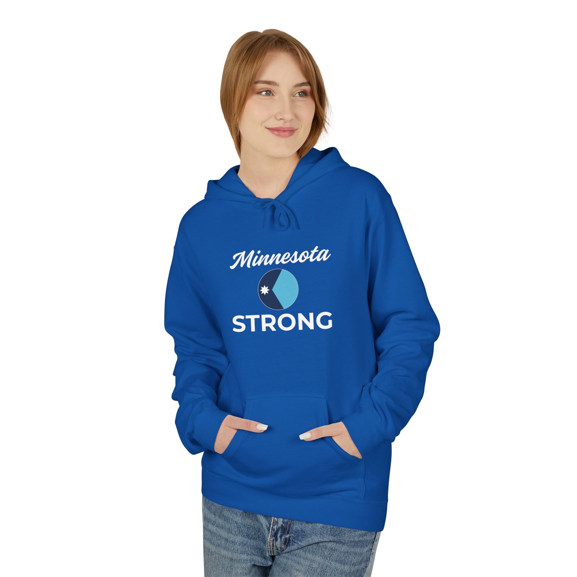Young woman in a bright blue Minnesota Strong hoodie, featuring script text and a circle graphic, hands in kangaroo pocket against a white background.