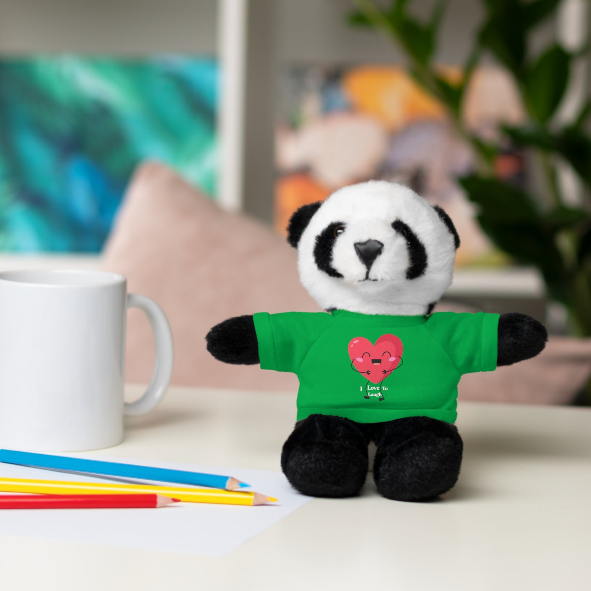 Stuffed panda bear with removable I Love to Laugh heart shirt, part of Cool Stuff Stuffies collection, featuring customizable cotton shirts and six animal options.