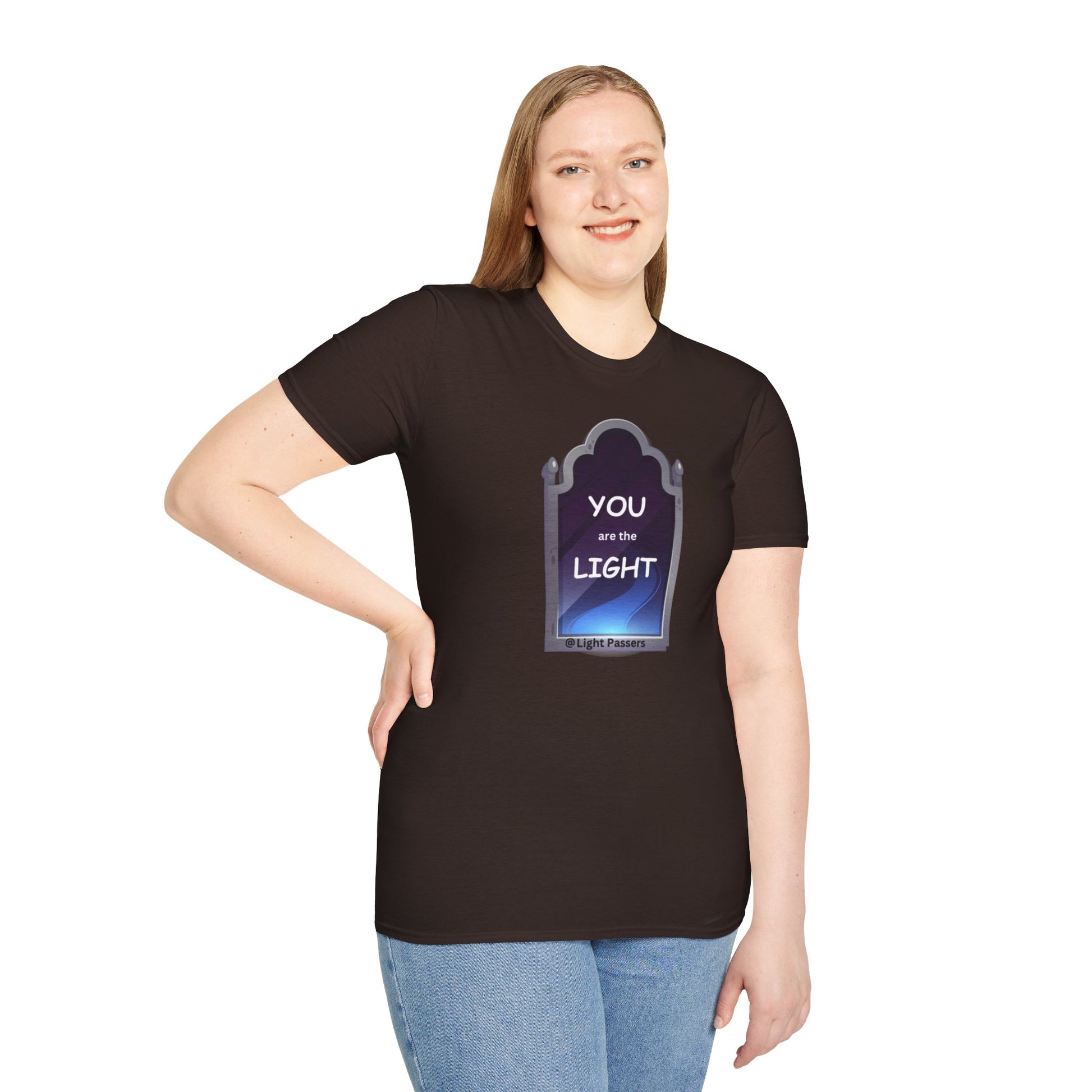 A woman in a black shirt smiles, showcasing the Light Mirror Unisex T-shirt. Close-up of blue jeans. Casual fashion staple with smooth surface for vivid printing.