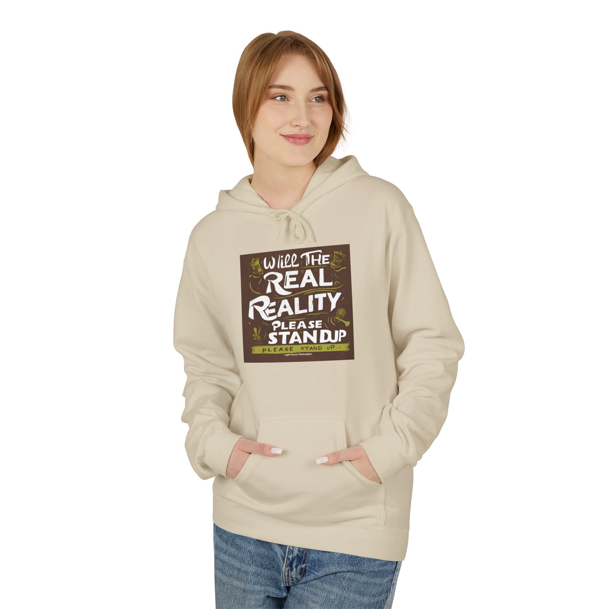 Young woman wearing the Will the Real Reality Please Stand Up hoodie, featuring a thought-provoking chest graphic, front pocket, and relaxed fit, from Light Passers Marketplace.