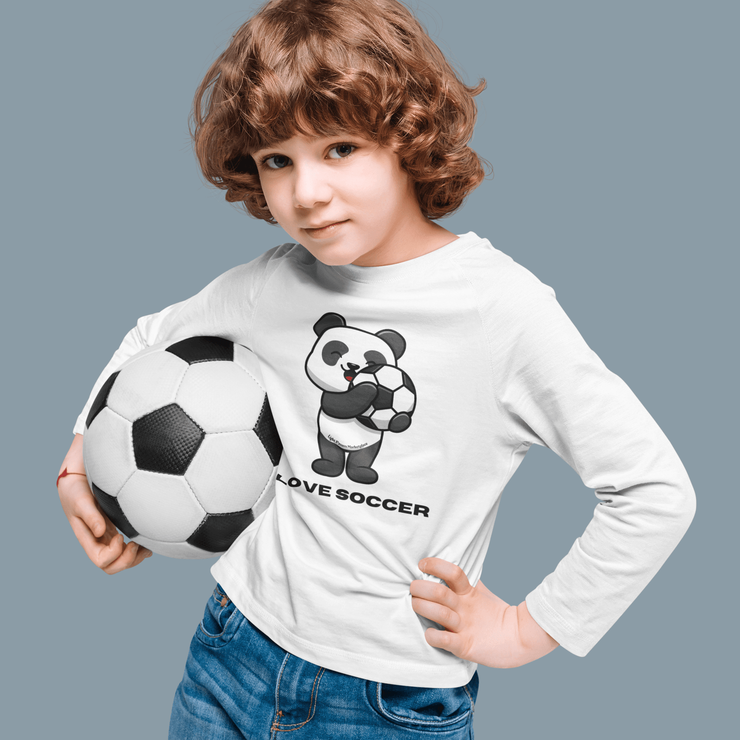 Youth Long Sleeve - Panda Says I Love Soccer, featuring a cartoon panda holding a football, worn by a child. Perfect for young soccer enthusiasts.