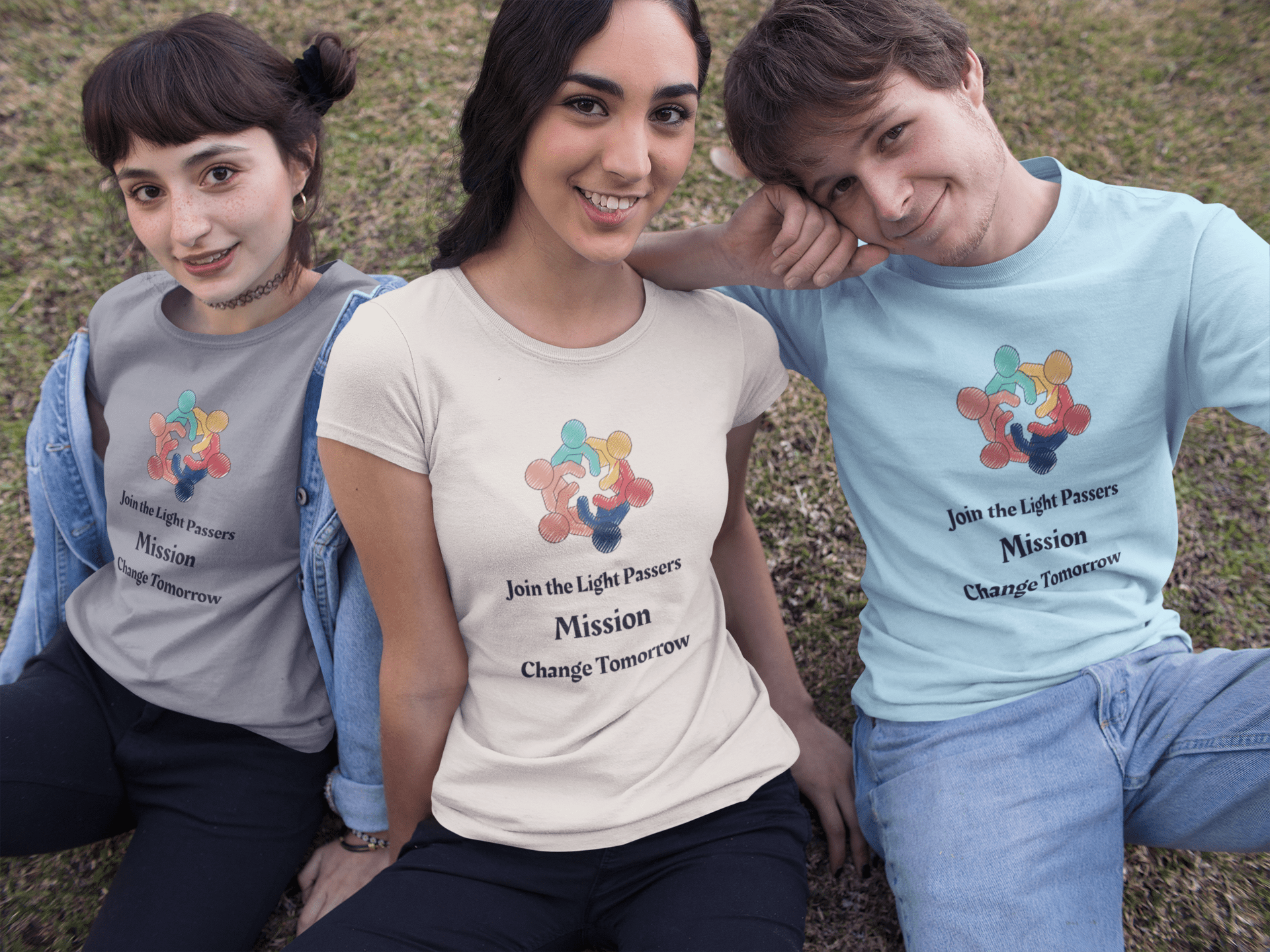 Three young adults model the Teams Love and Peace Change Makers Unite T-Shirts, promoting unity and positive change with a “people holding hands” logo.