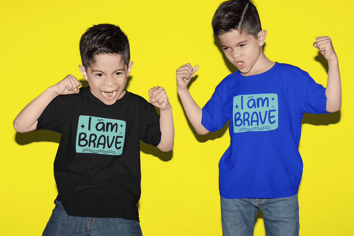 Royal blue kids T-shirt with 'I am BRAVE' graphic, worn by two children