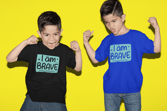 Royal blue kids T-shirt with 'I am BRAVE' graphic, worn by two children