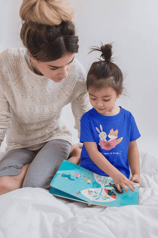 Blue toddler T-shirt with colorful storybook graphic and small text 'upon a time'.
