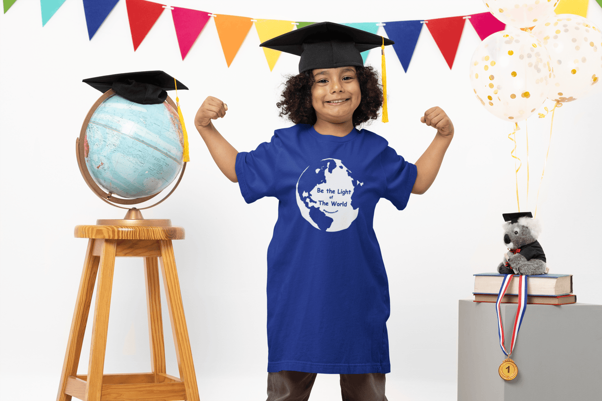 Toddler royal blue T-shirt with globe “Be The Light Of The World” graphic, worn by child