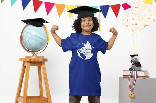 Toddler royal blue T-shirt with globe “Be The Light Of The World” graphic, worn by child