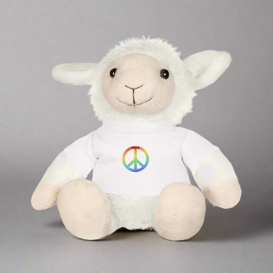 Peace Sheep Cuddle Buddy features a plush sheep with a removable t-shirt adorned with a rainbow peace sign, perfect for kids aged 3 and above.