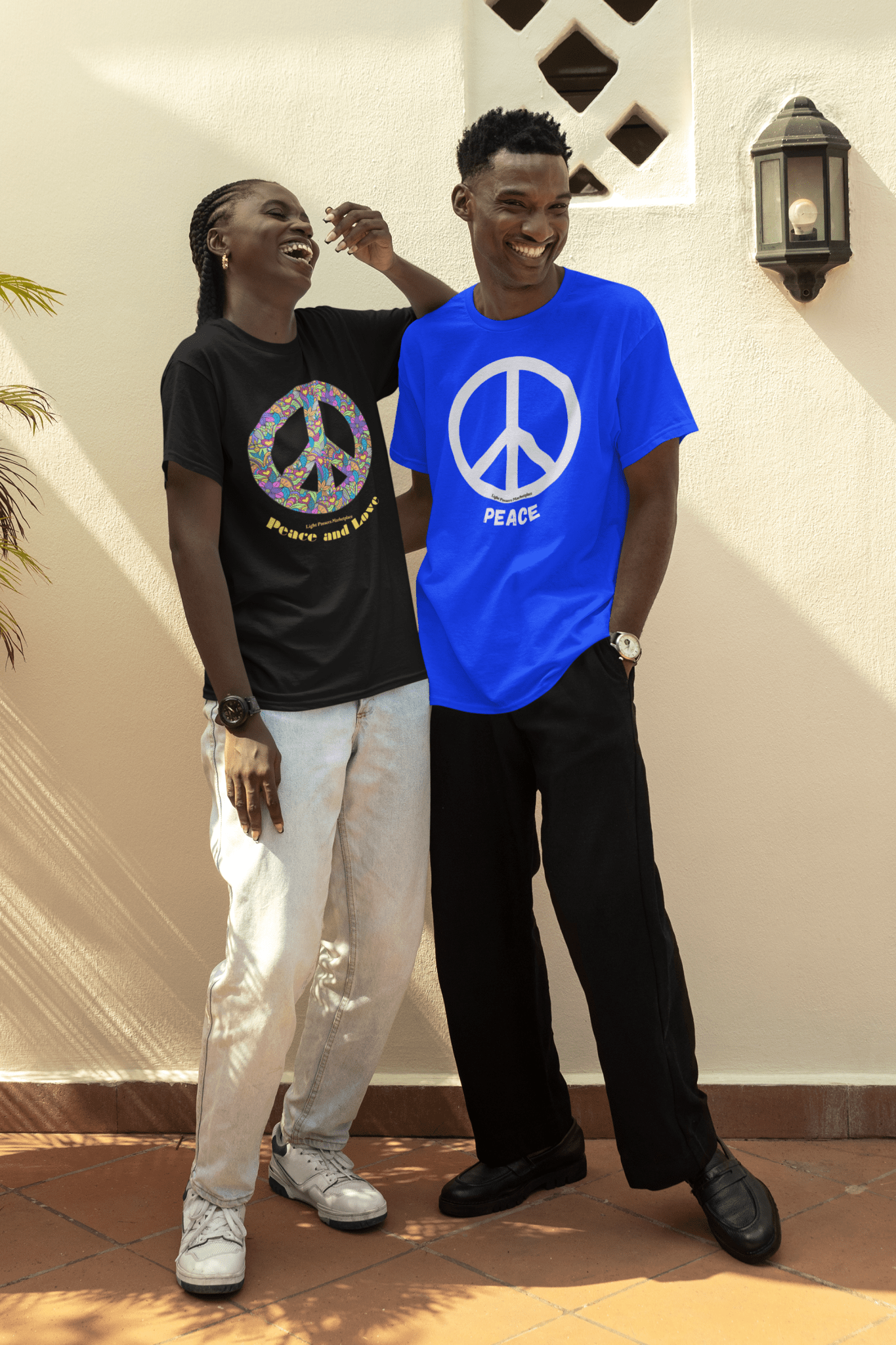 A man and woman stand together, showcasing a Peace Sign black or white Unisex T-Shirt. Made of soft 100% cotton, featuring a peace symbol on a blue shirt. No side seams, ribbed collar for durability.