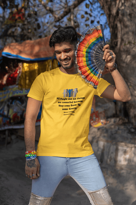 A man holding a colorful fan, showcasing All People are Connected Gray and blue design Unisex T-shirt. Classic fit, 100% cotton, tear-away label, no side seams for comfort.
