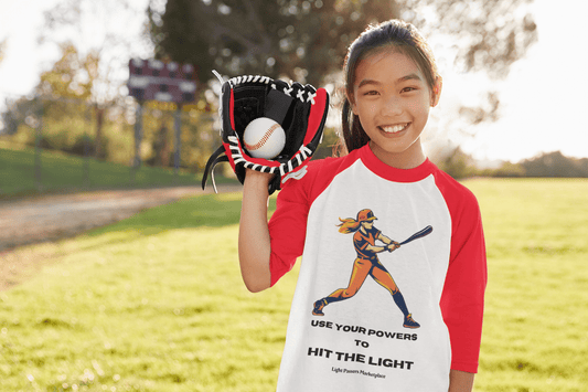 A girl holds a baseball glove and ball, showcasing a 3/4 sleeve baseball tee. Unisex, ribbed collar, airy fabric blend for durability and comfort.